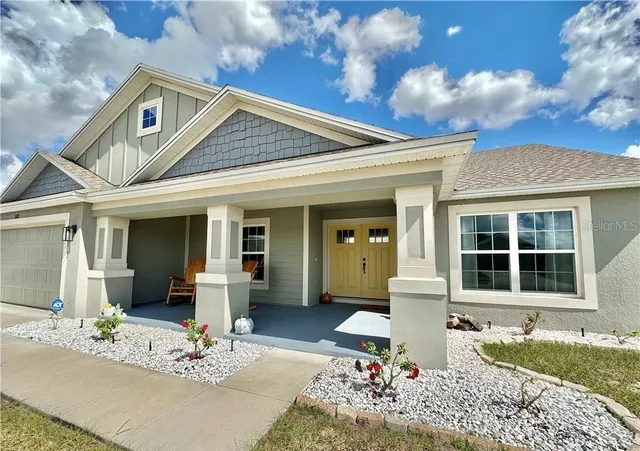 a front view of a house with a sitting area