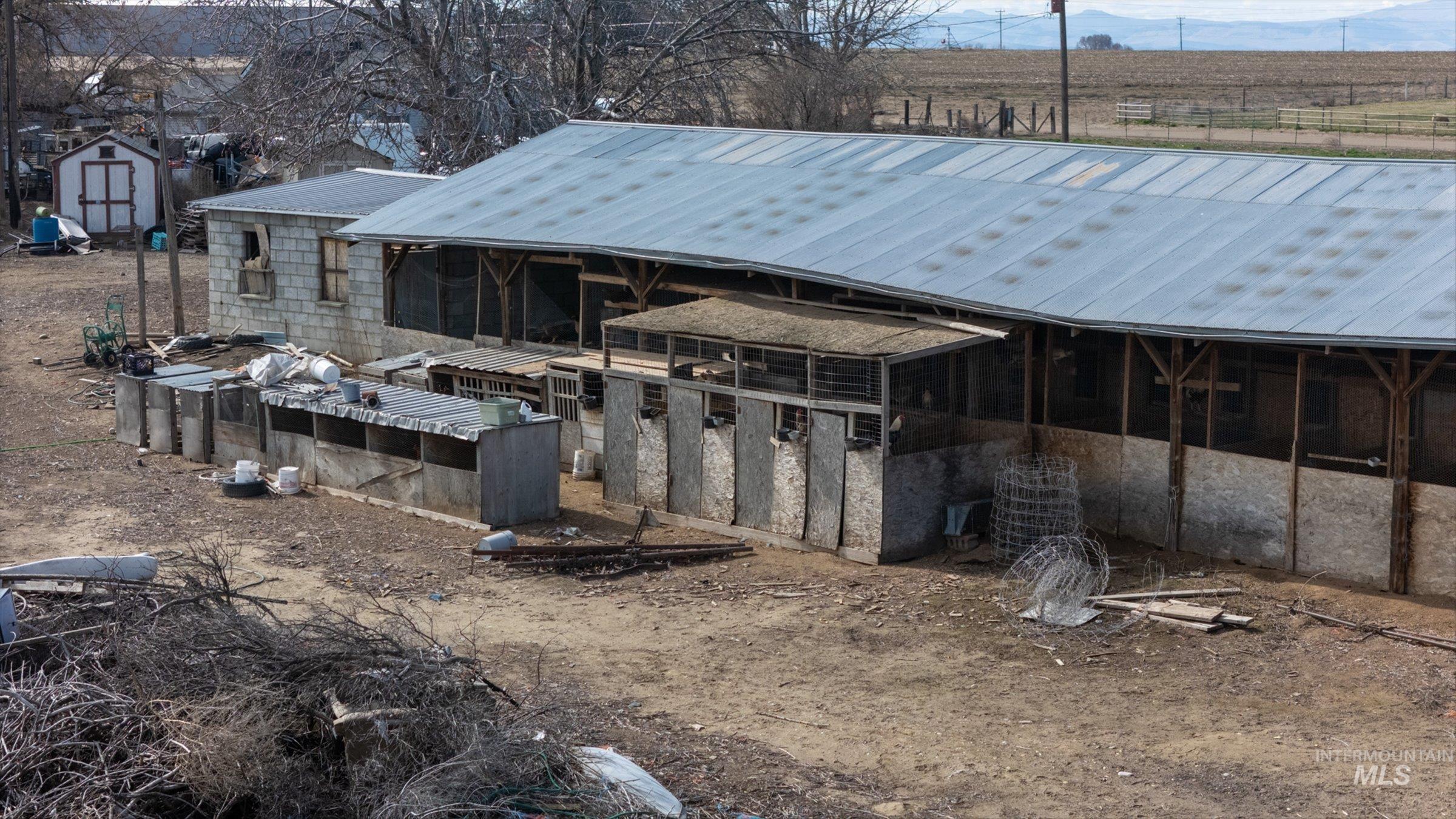 20286 Travis Road Wilder, ID 83676 - Photo 31 of 48 View of outbuilding featuring an exterior structure and a rural view
