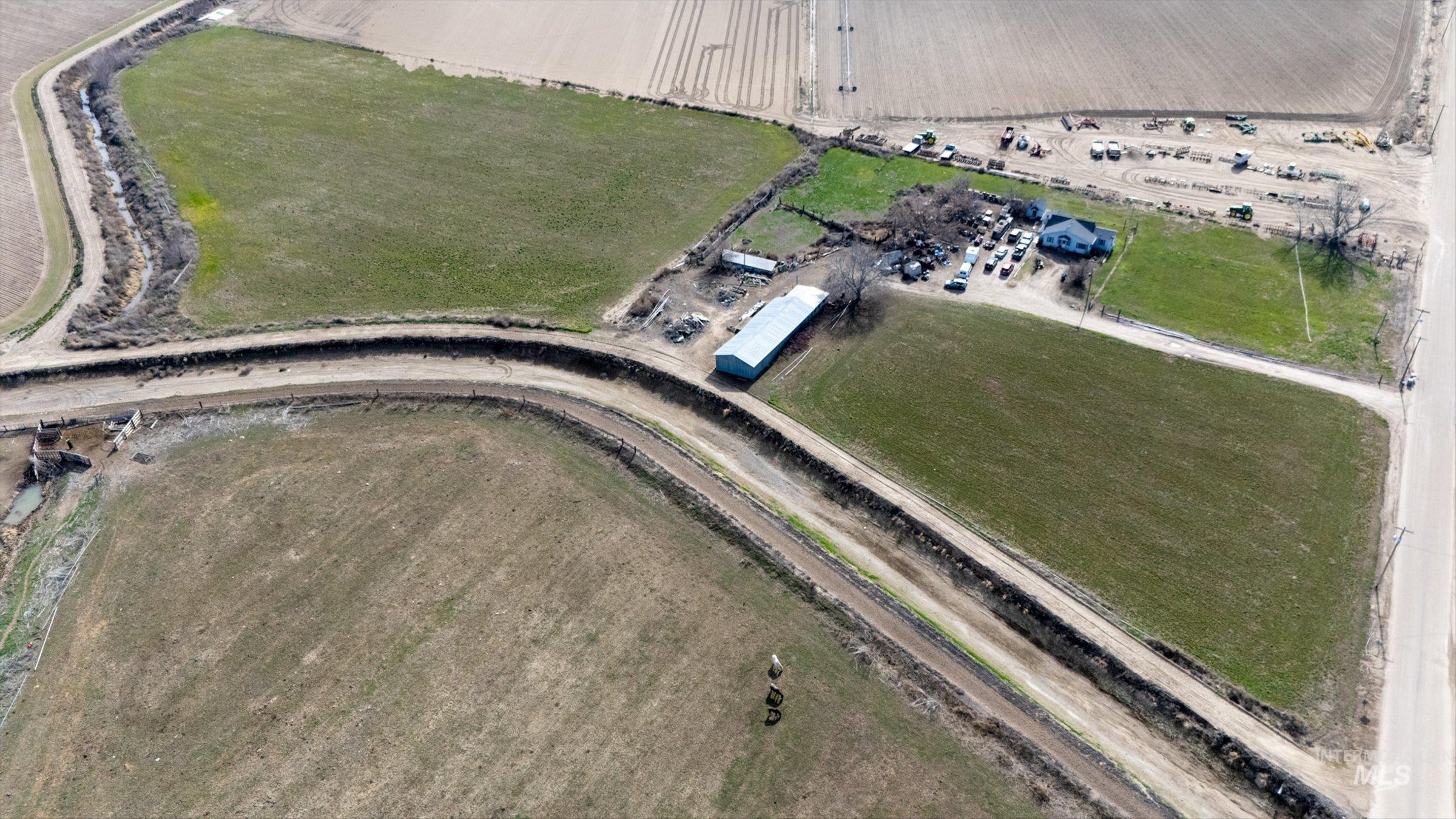 20286 Travis Road Wilder, ID 83676 - Photo 38 of 48 Aerial view of property and surrounding area with rural landscape and abundant farmland