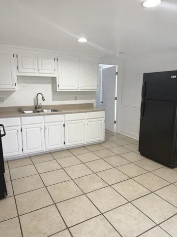 a kitchen with a sink and cabinets