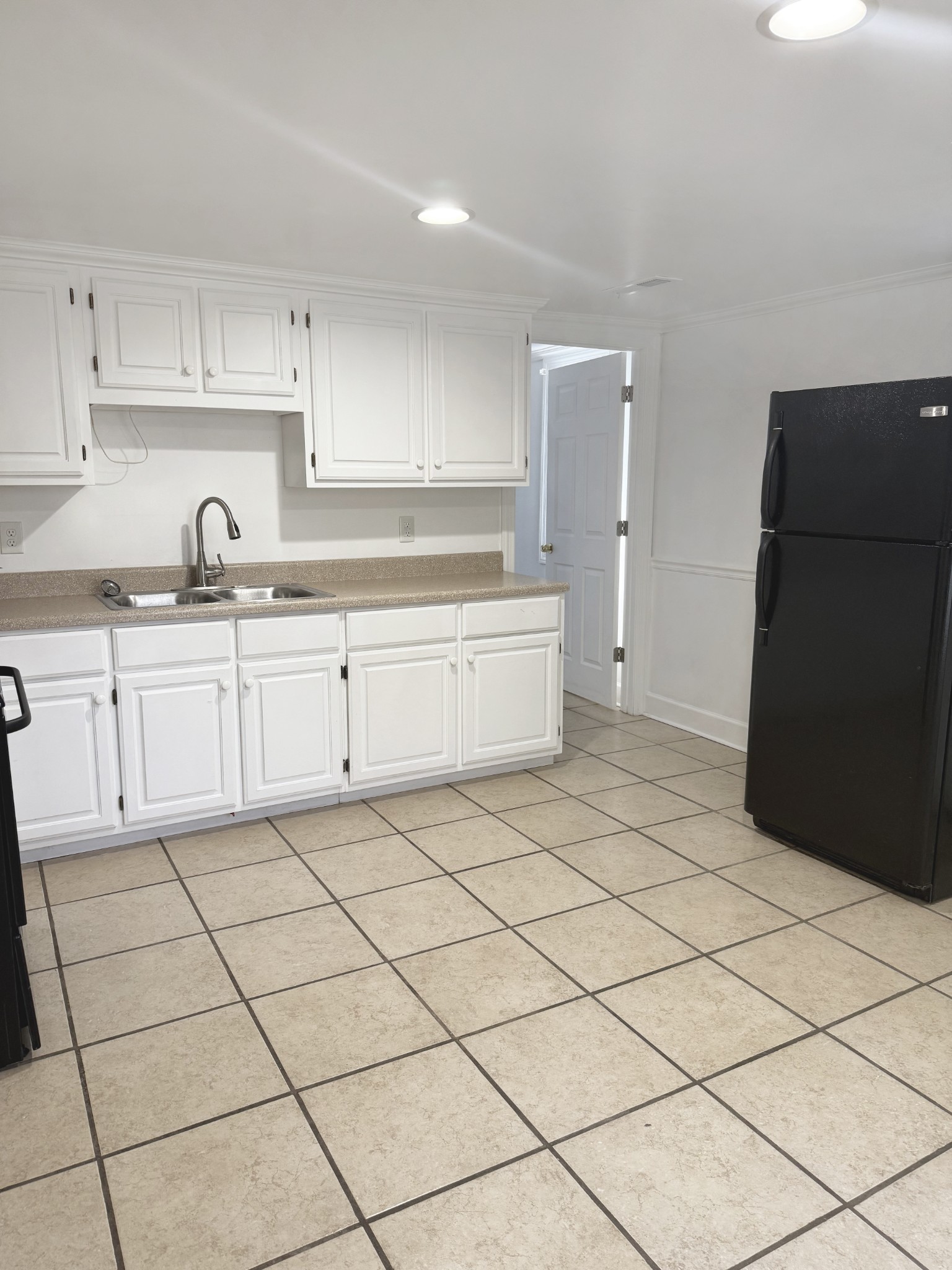 1206 North Church Street, Unit B Murfreesboro, TN 37130 - Photo 11 of 13 a kitchen with a sink and cabinets