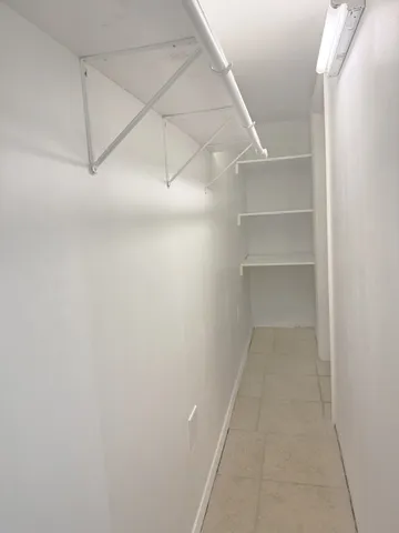 a view of a room with rack on the wall