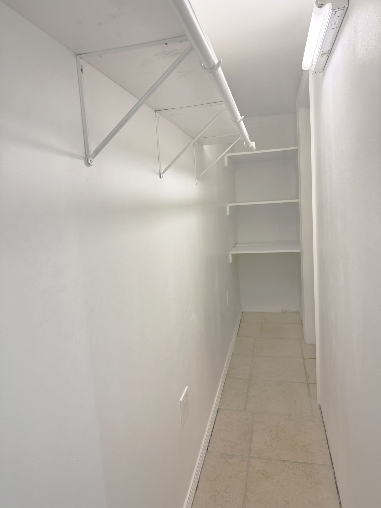 1206 North Church Street, Unit B Murfreesboro, TN 37130 - Photo 7 of 13 a view of a room with rack on the wall