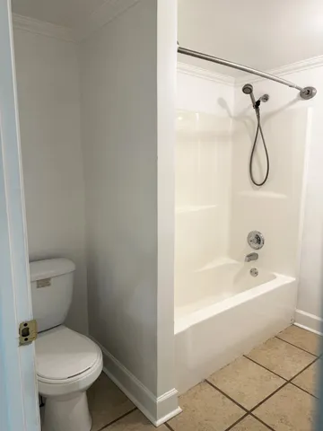 a bathroom with a toilet and a bathtub