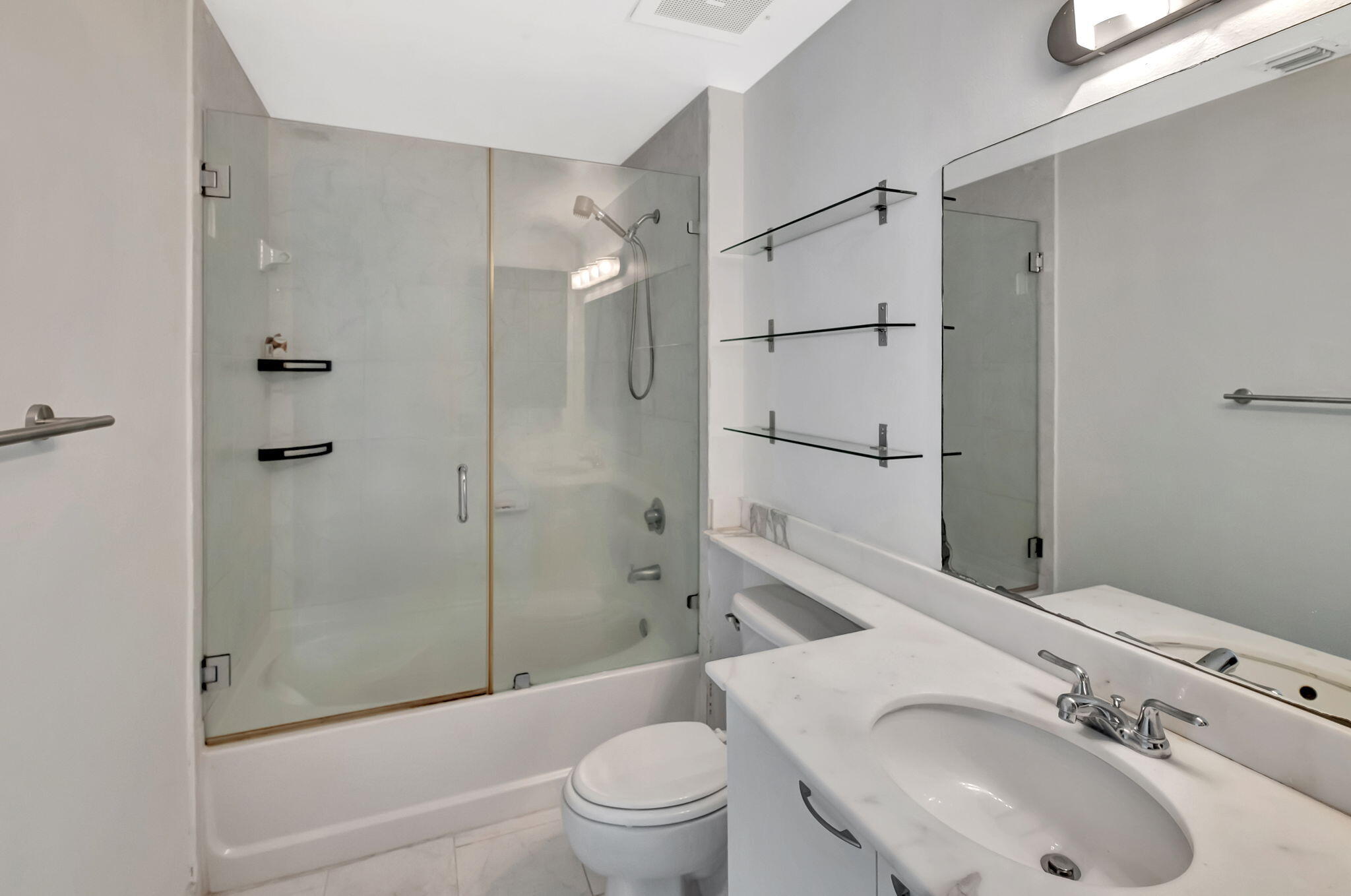 234 Northeast 3rd Street, Unit 2206 Miami, FL 33132 - Photo 16 of 30 a bathroom with a sink toilet and shower