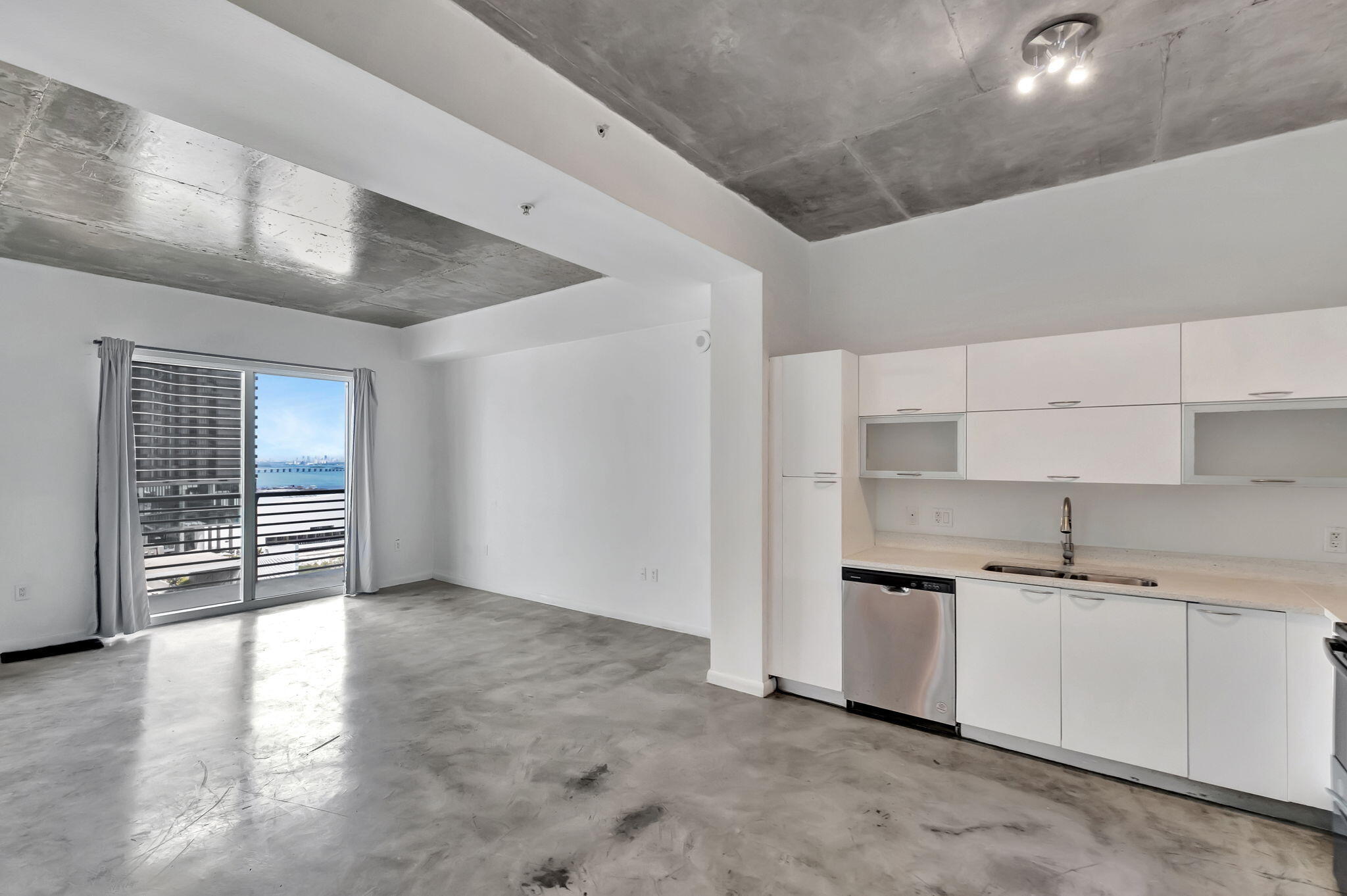 234 Northeast 3rd Street, Unit 2206 Miami, FL 33132 - Photo 2 of 30 a kitchen with stainless steel appliances a sink stove and cabinets