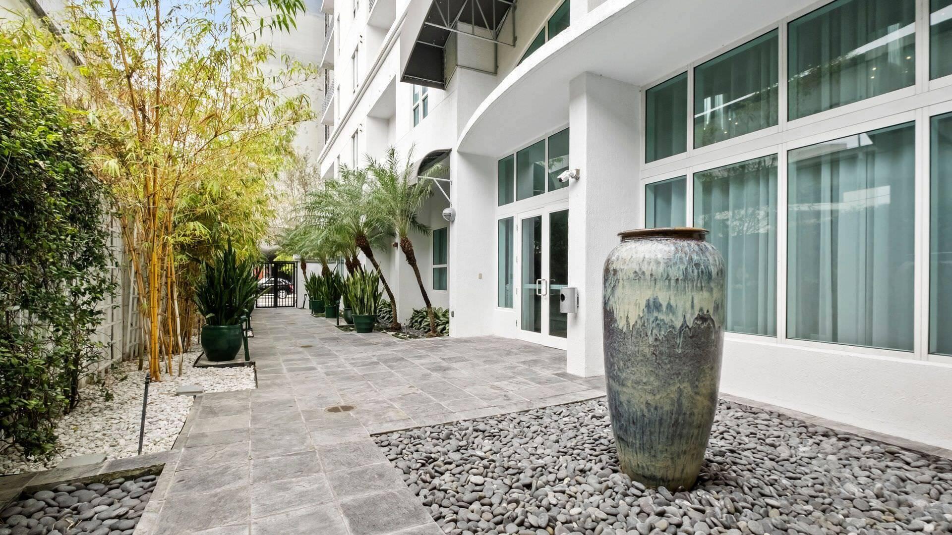 234 Northeast 3rd Street, Unit 2206 Miami, FL 33132 - Photo 21 of 30 a view of a street with potted plants