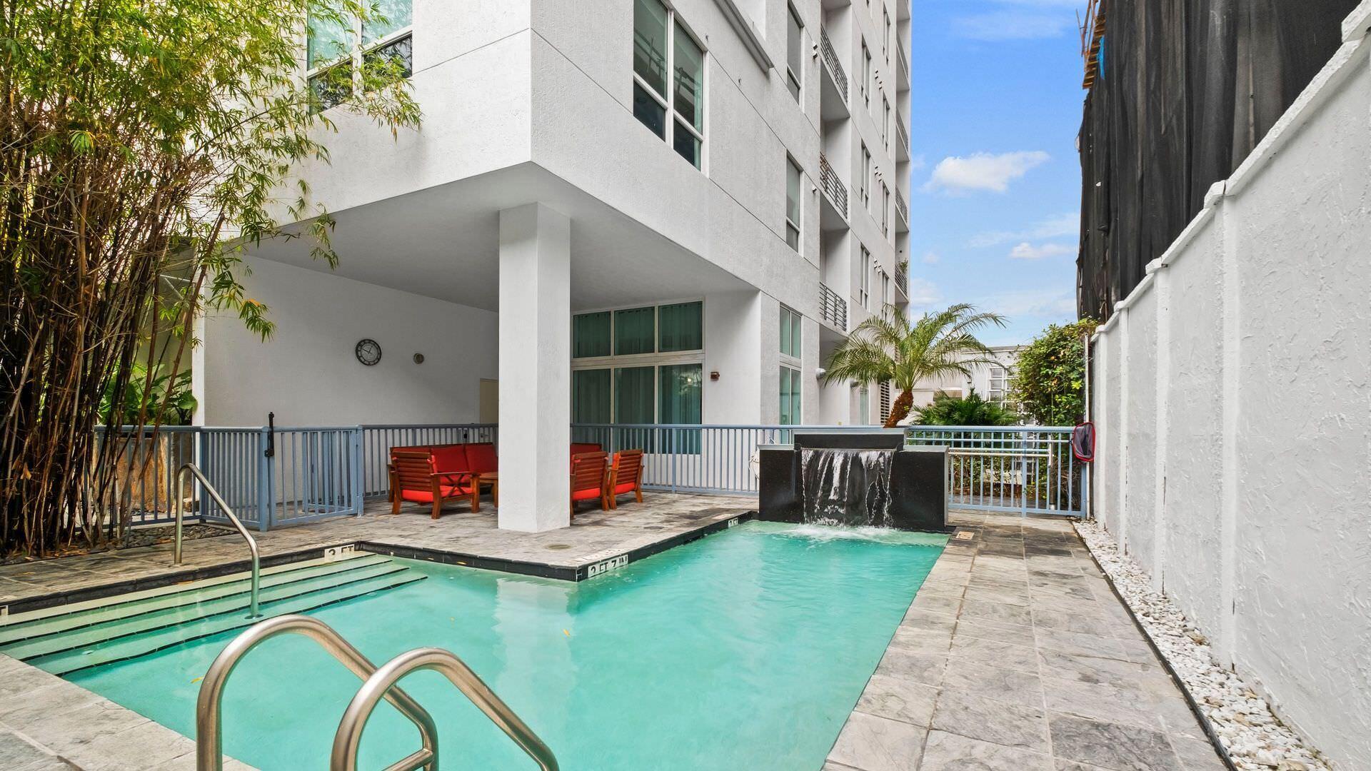 234 Northeast 3rd Street, Unit 2206 Miami, FL 33132 - Photo 26 of 30 a view of a dinning table and chairs in patio