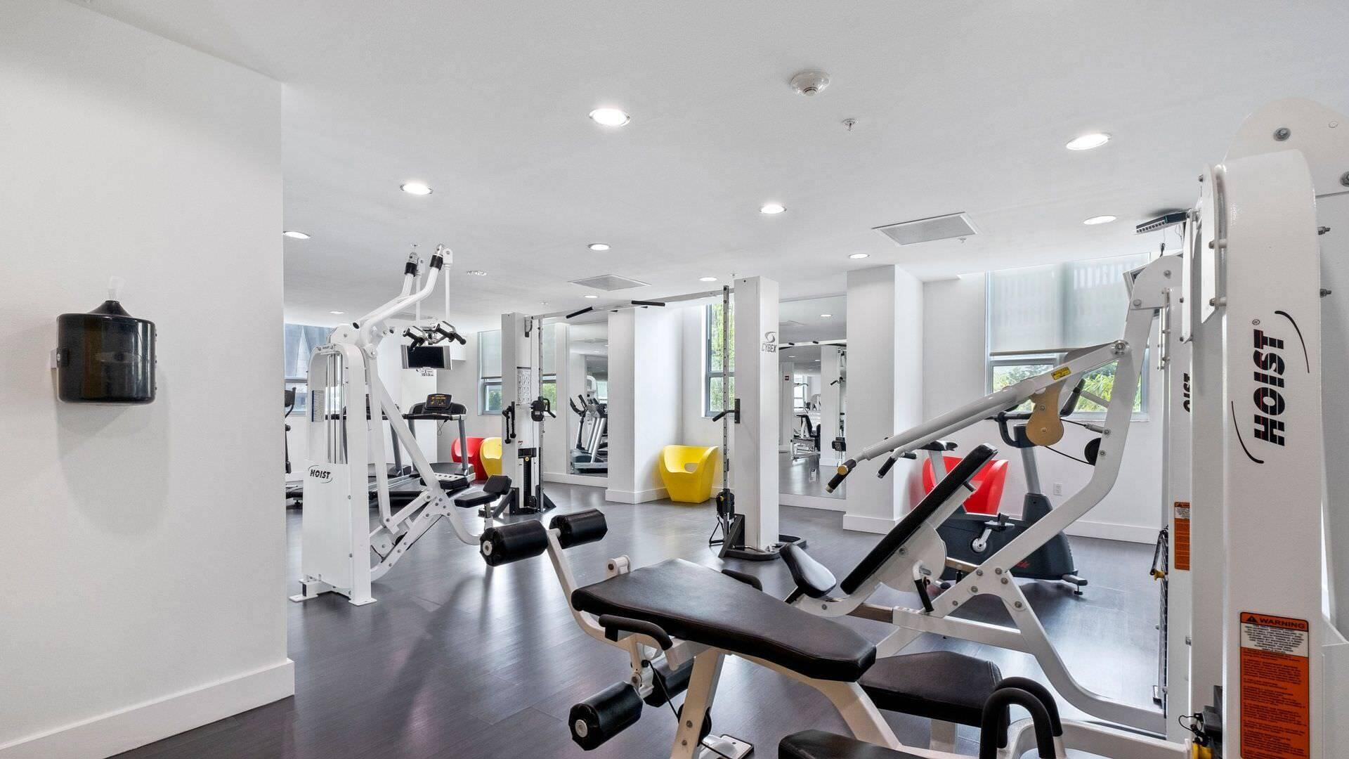 234 Northeast 3rd Street, Unit 2206 Miami, FL 33132 - Photo 27 of 30 a view of a room with gym equipment