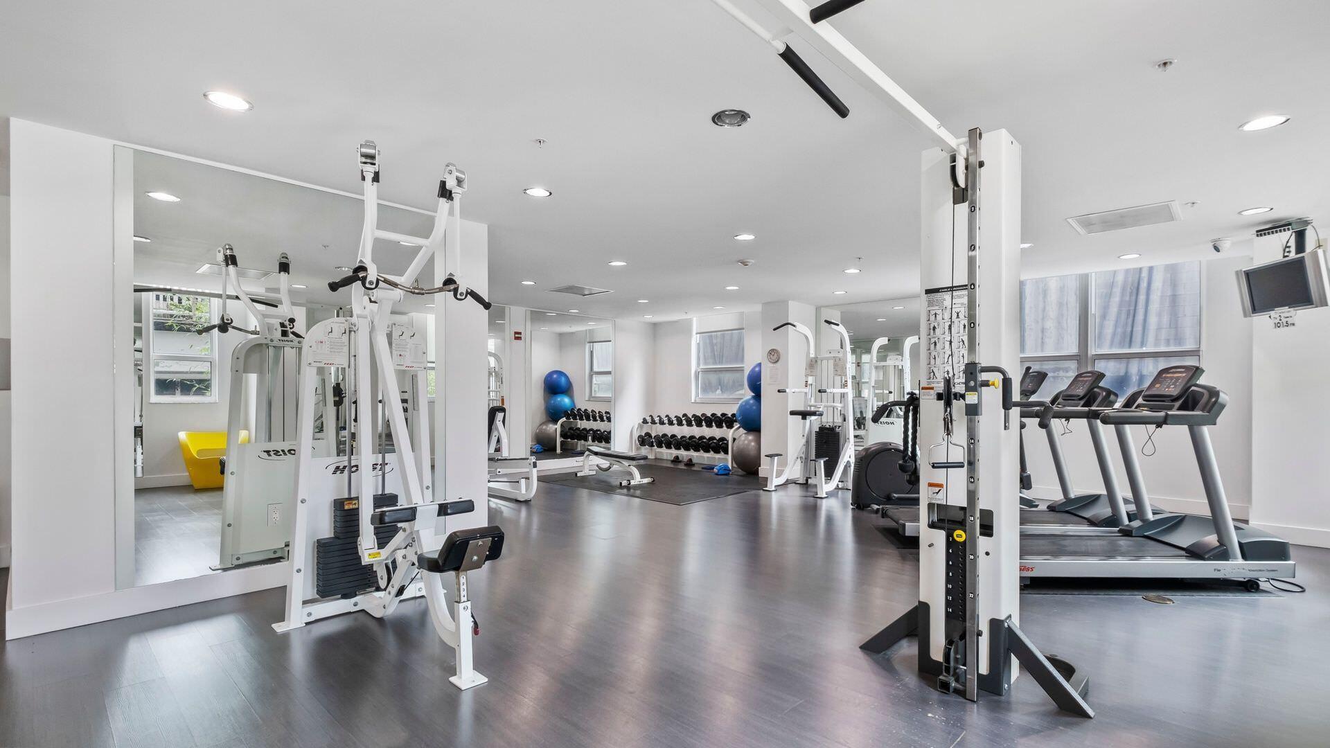 234 Northeast 3rd Street, Unit 2206 Miami, FL 33132 - Photo 29 of 30 a view of a room with gym equipment