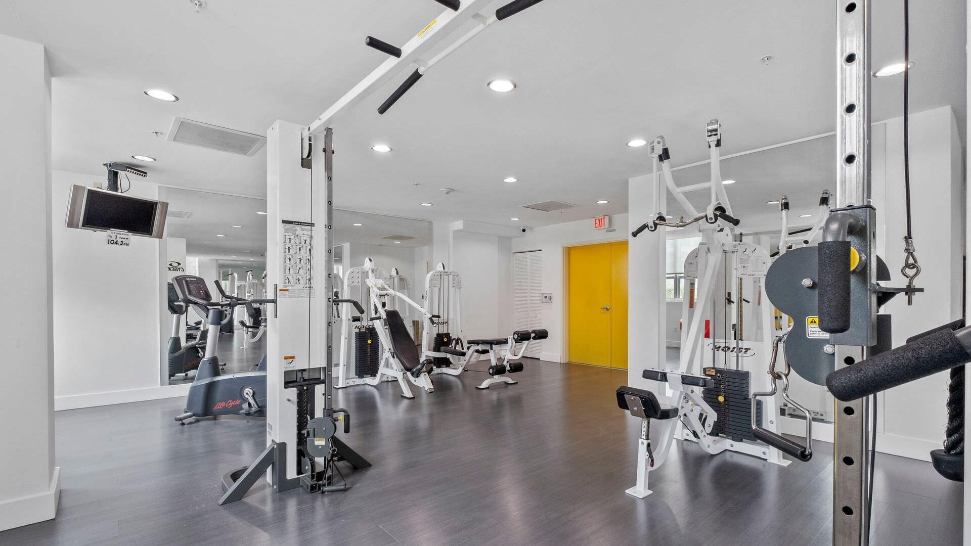234 Northeast 3rd Street, Unit 2206 Miami, FL 33132 - Photo 30 of 30 a view of a room with gym equipment