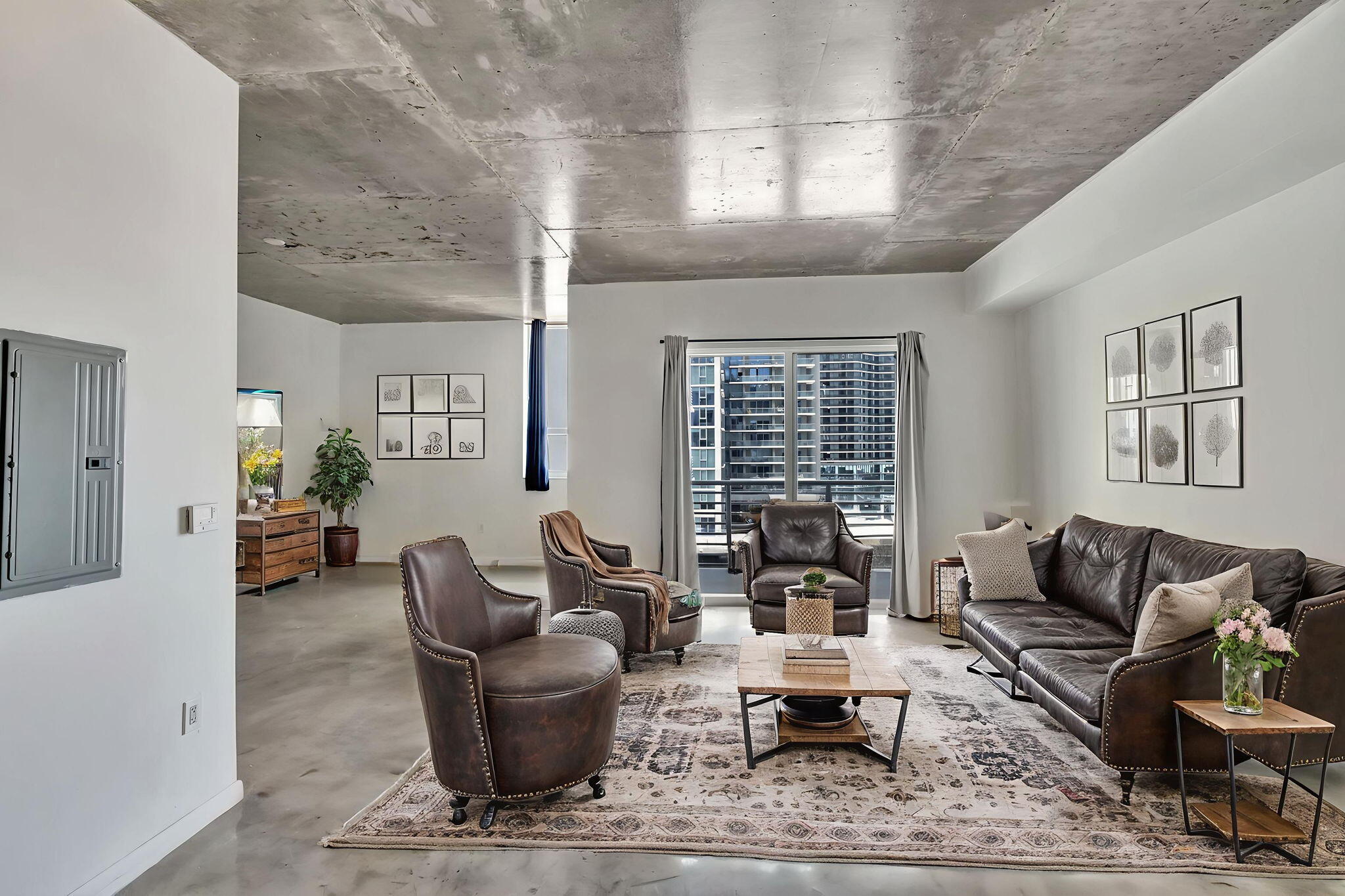 234 Northeast 3rd Street, Unit 2206 Miami, FL 33132 - Photo 5 of 30 a living room with furniture and a large window