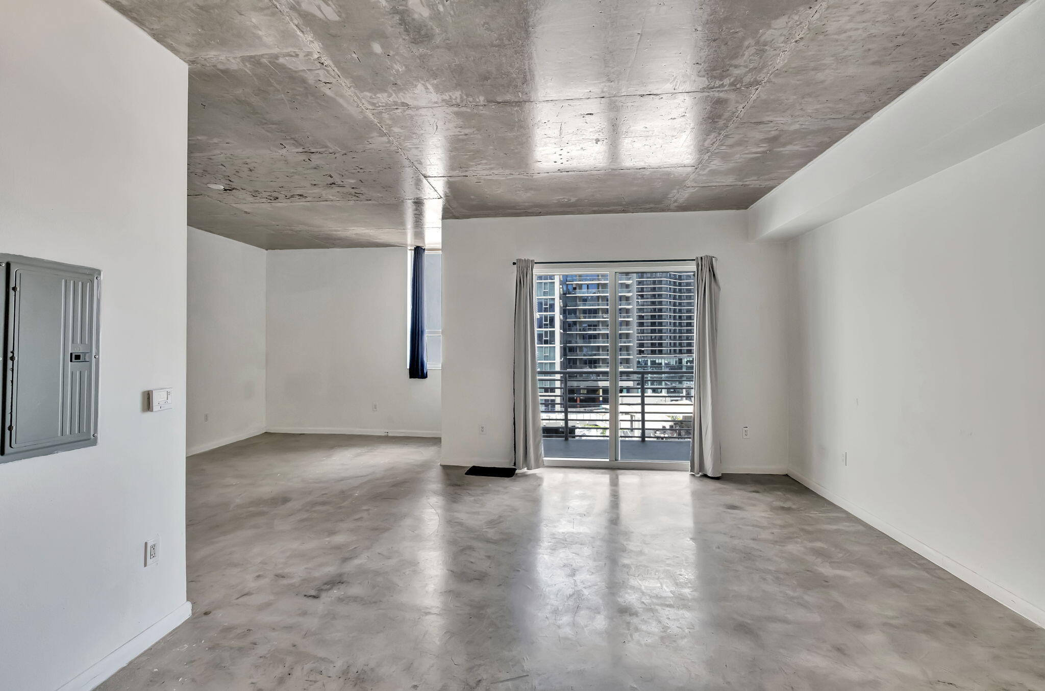 234 Northeast 3rd Street, Unit 2206 Miami, FL 33132 - Photo 6 of 30 a view of an empty room with a window
