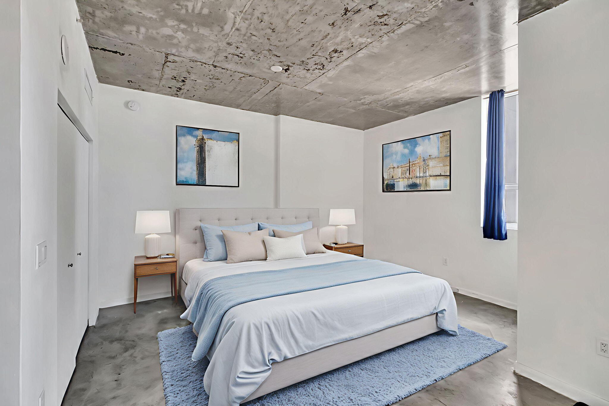 234 Northeast 3rd Street, Unit 2206 Miami, FL 33132 - Photo 8 of 30 a bedroom with a bed and a painting on the wall