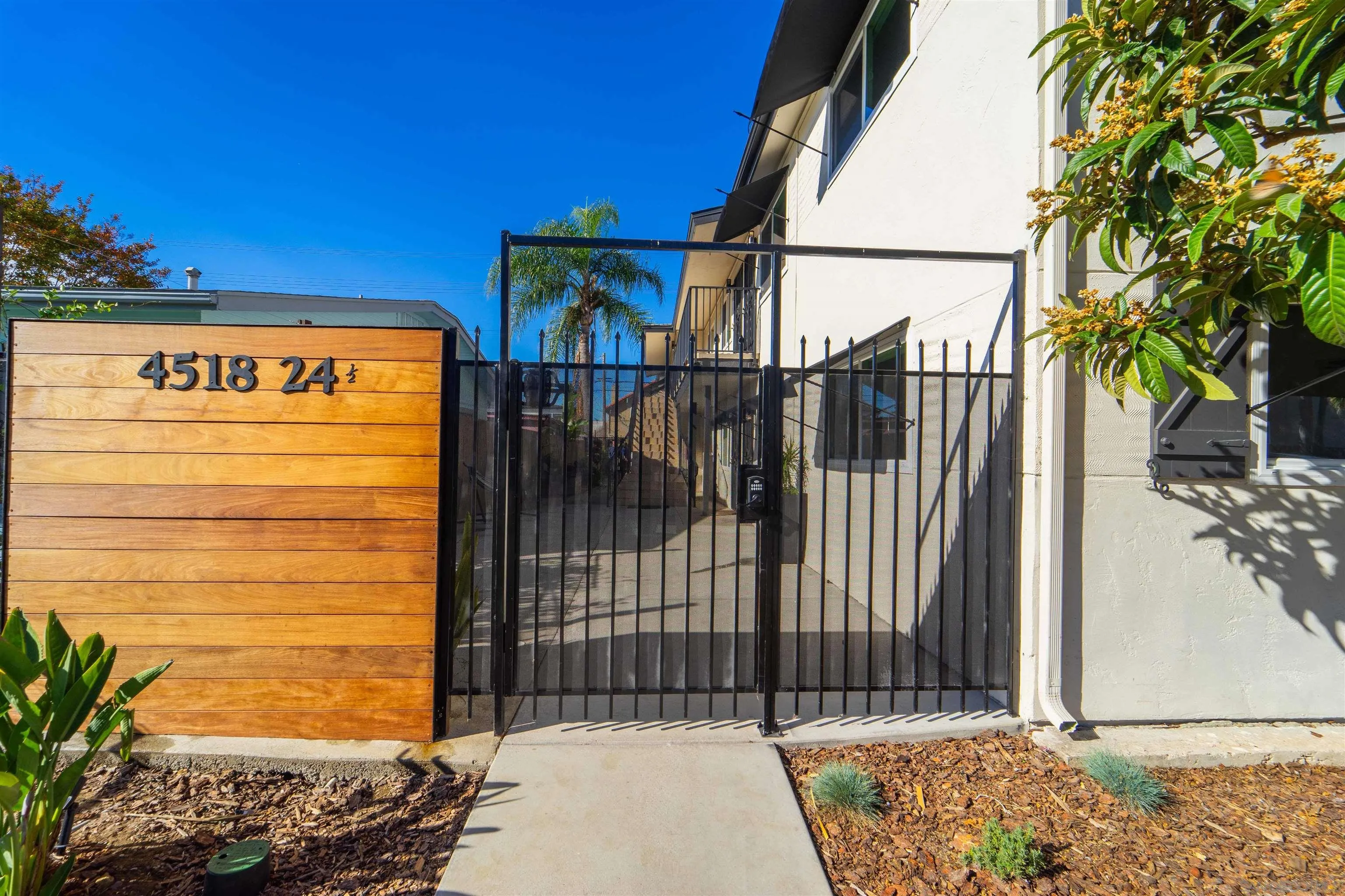 4518-24 Kansas Street San Diego, CA 92116 - Photo 11 of 33 a view of a wooden door with a house