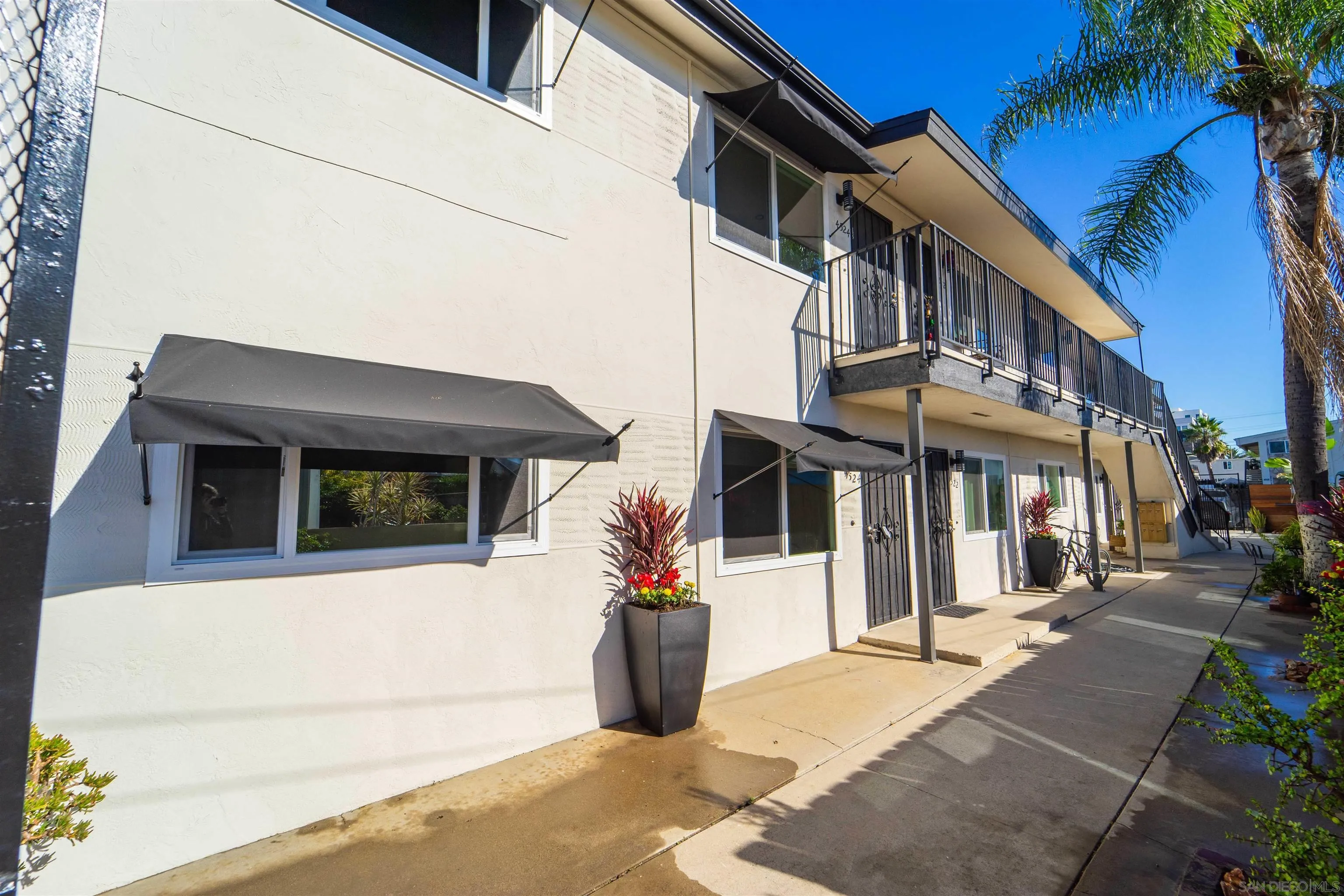 4518-24 Kansas Street San Diego, CA 92116 - Photo 13 of 33 a view of a building with a bench