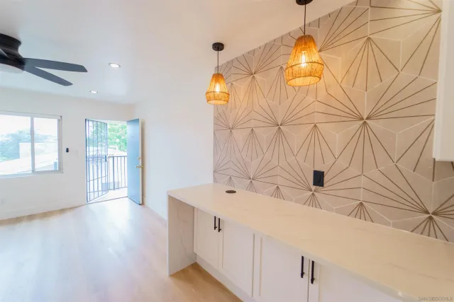 a view of a kitchen with electric appliances