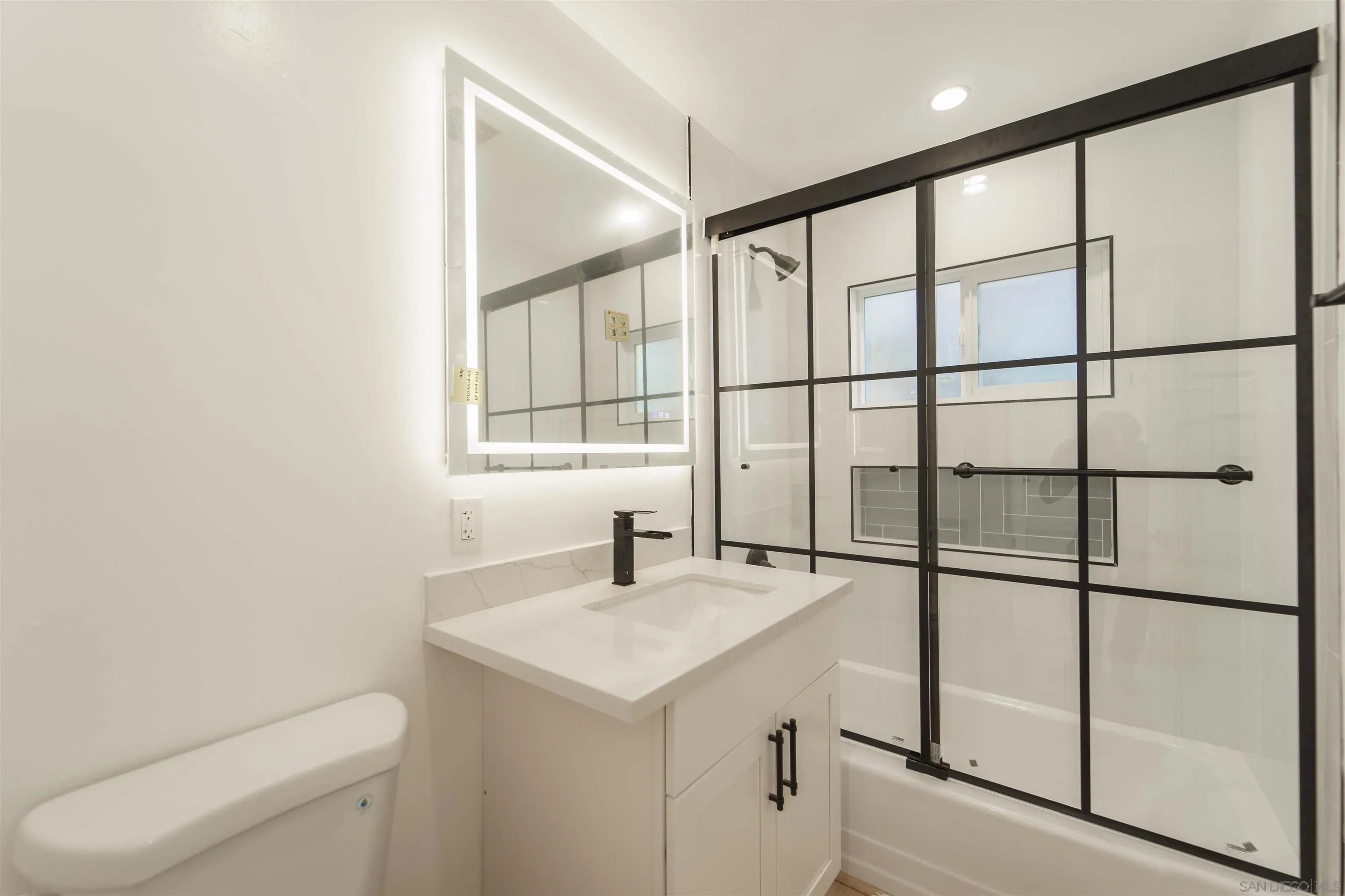 4518-24 Kansas Street San Diego, CA 92116 - Photo 23 of 33 a bathroom with a sink and a toilet