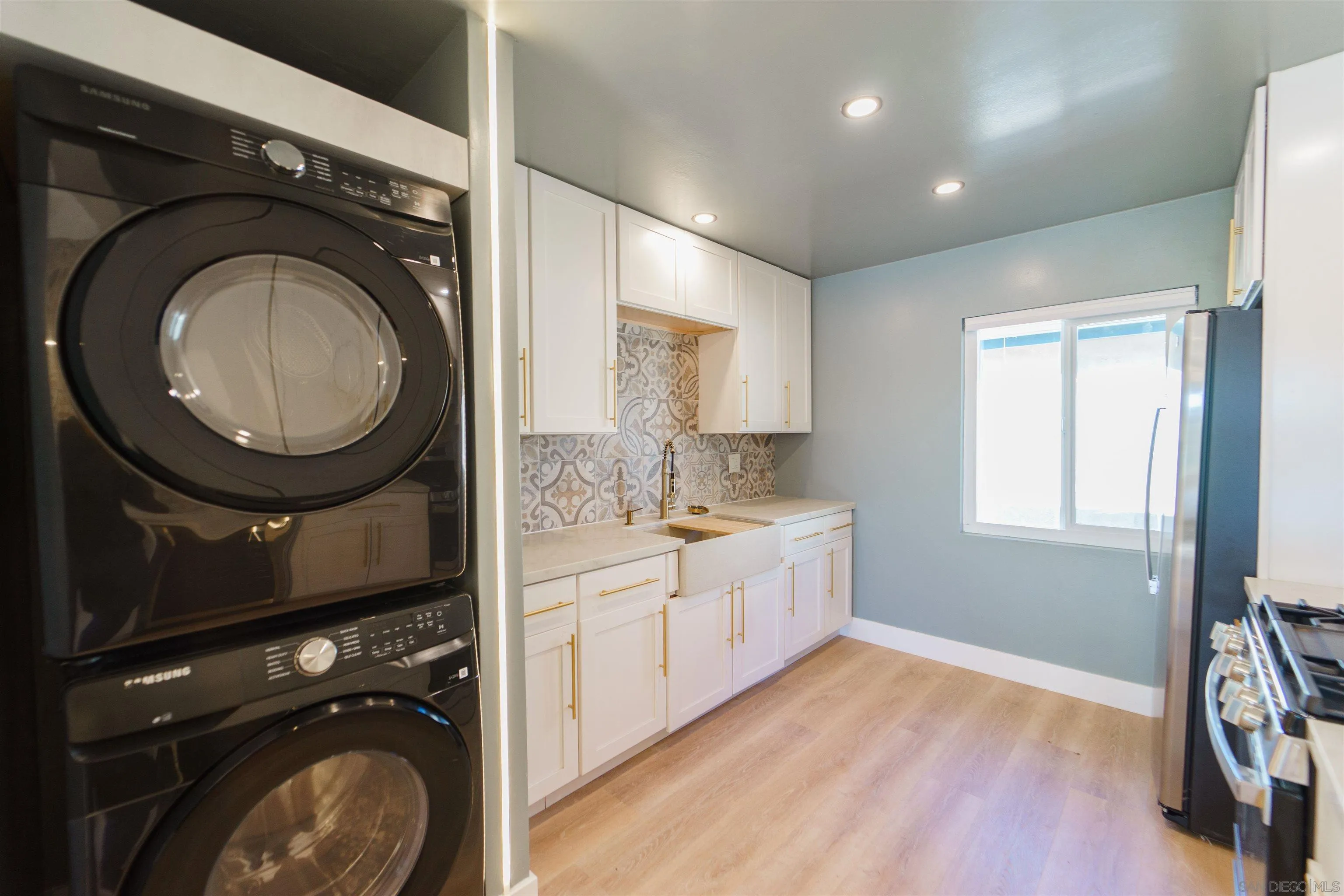 4518-24 Kansas Street San Diego, CA 92116 - Photo 24 of 33 a view of a bathroom with washing machine and mirror