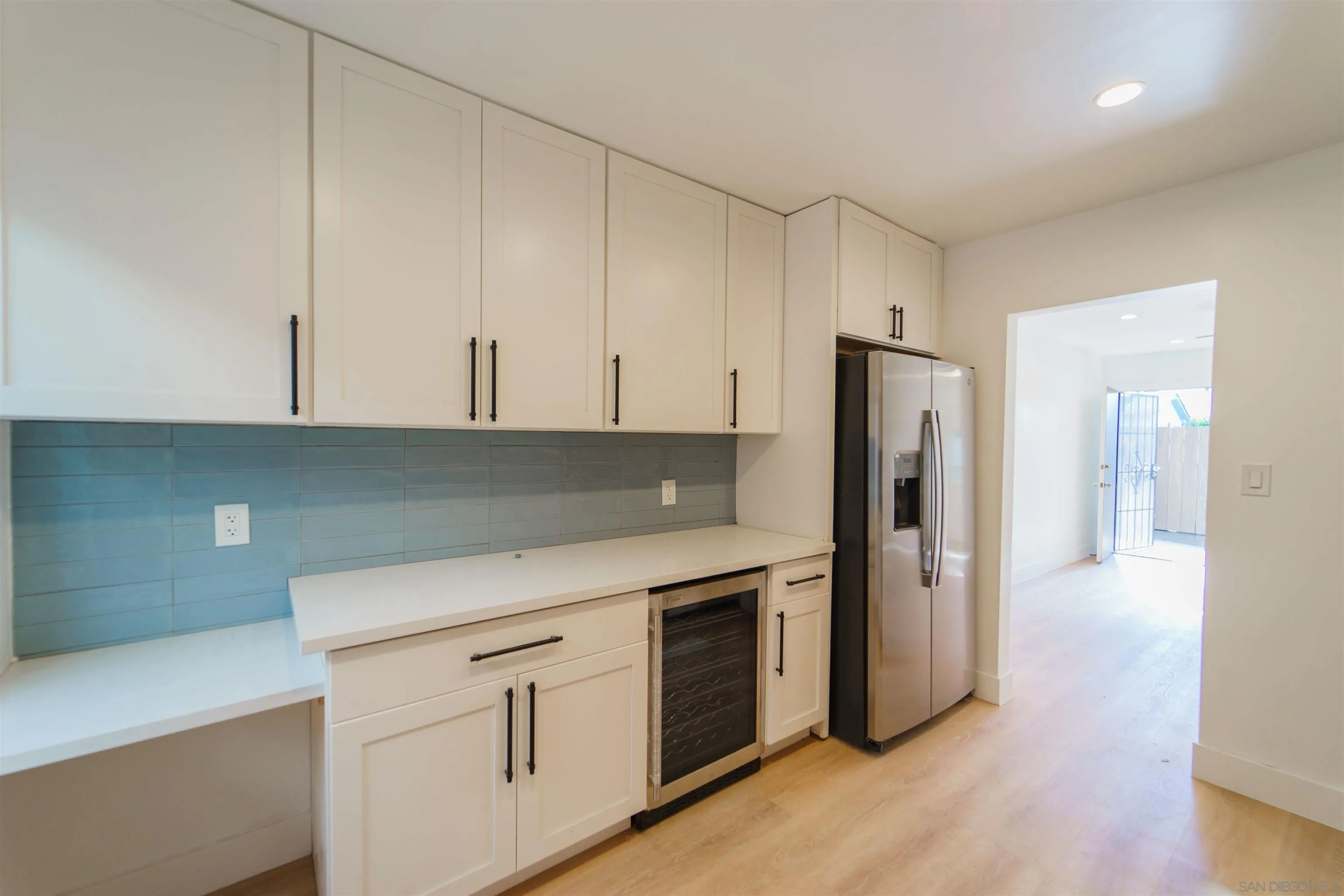 4518-24 Kansas Street San Diego, CA 92116 - Photo 29 of 33 a kitchen with a white cabinets and white appliances