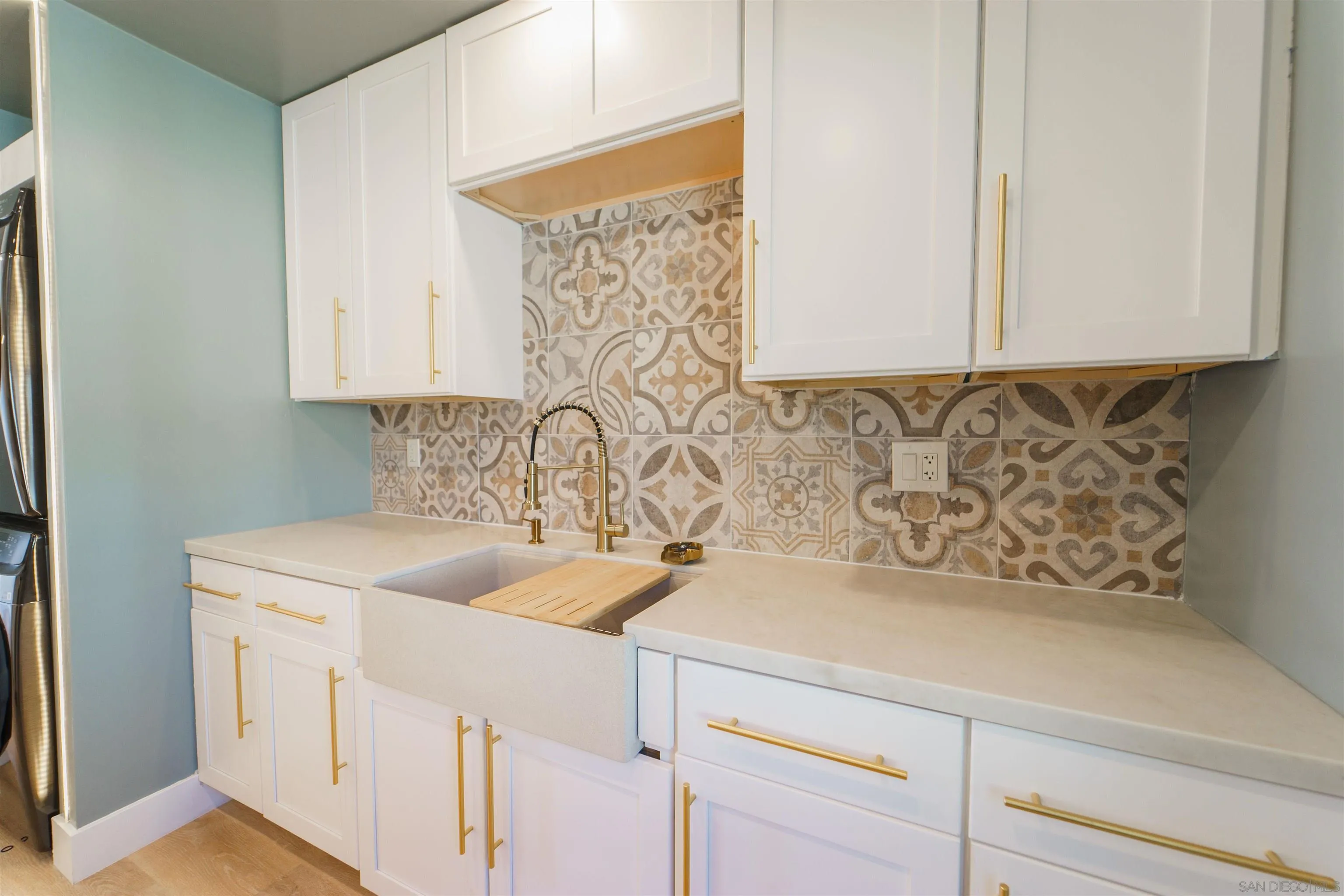 4518-24 Kansas Street San Diego, CA 92116 - Photo 31 of 33 a bathroom with a sink and cabinets