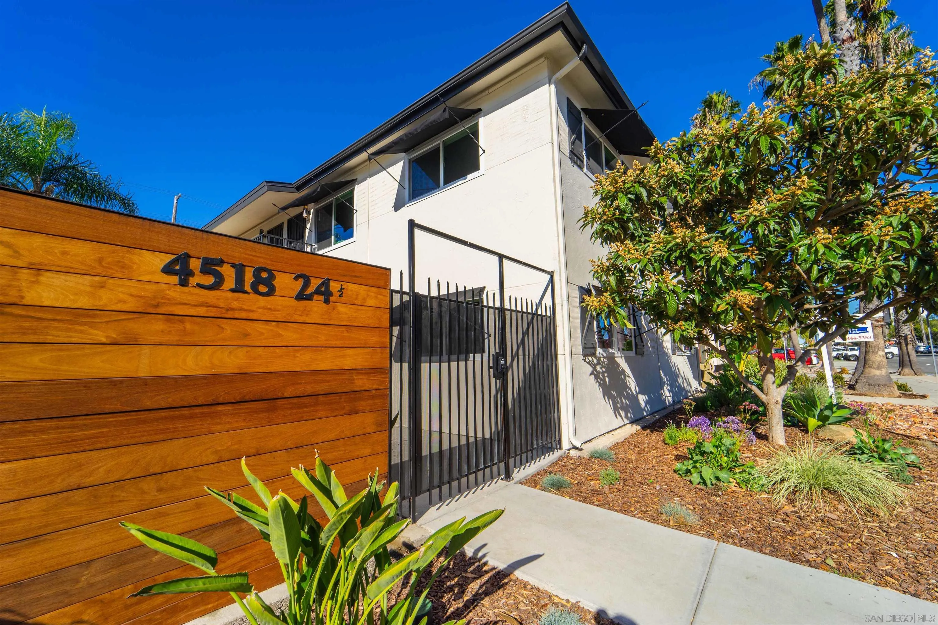 4518-24 Kansas Street San Diego, CA 92116 - Photo 10 of 33 a sign on the side of a building