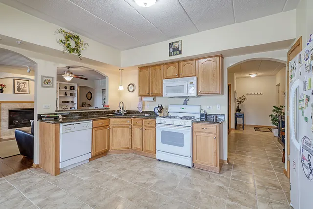 a kitchen with a sink stove and refrigerator
