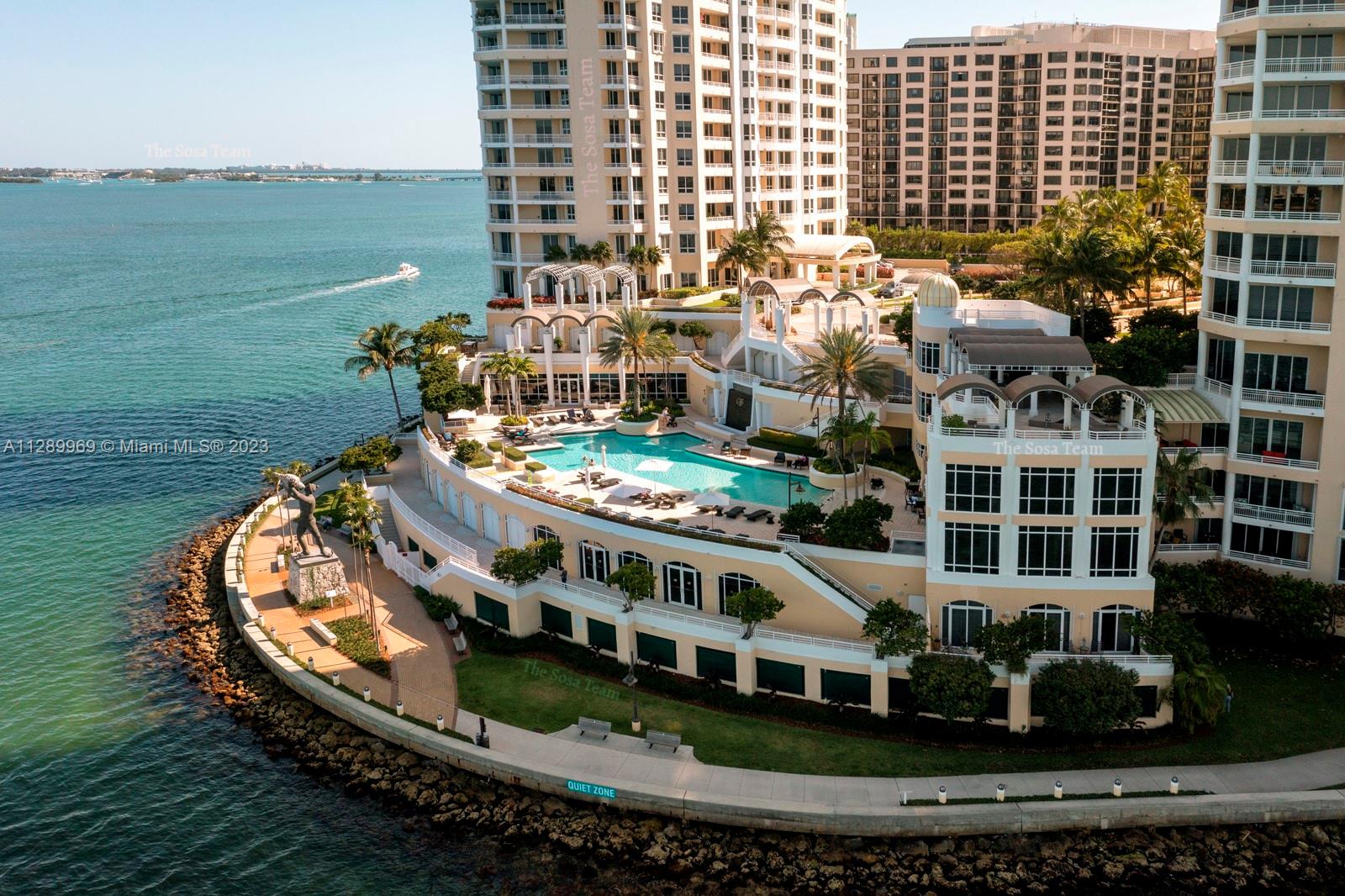 848 Brickell Key Drive, Unit 1602 Miami, FL 33131 - Photo 22 of 33 a large building with swimming pool in front of it