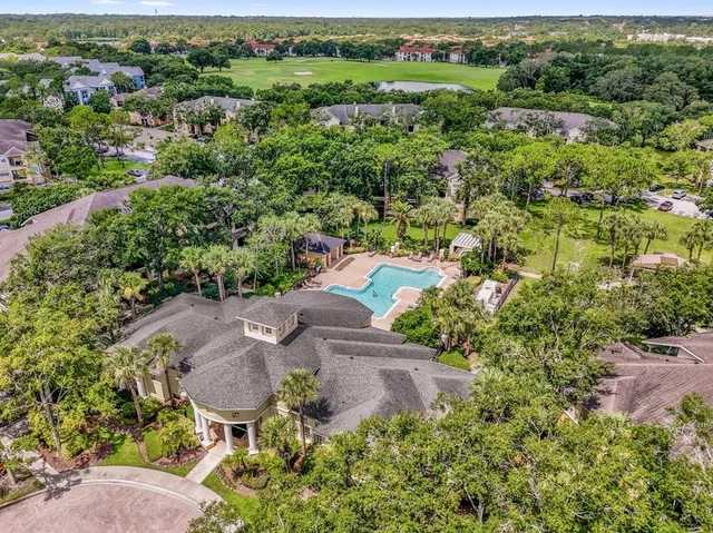an aerial view of a house with outdoor space