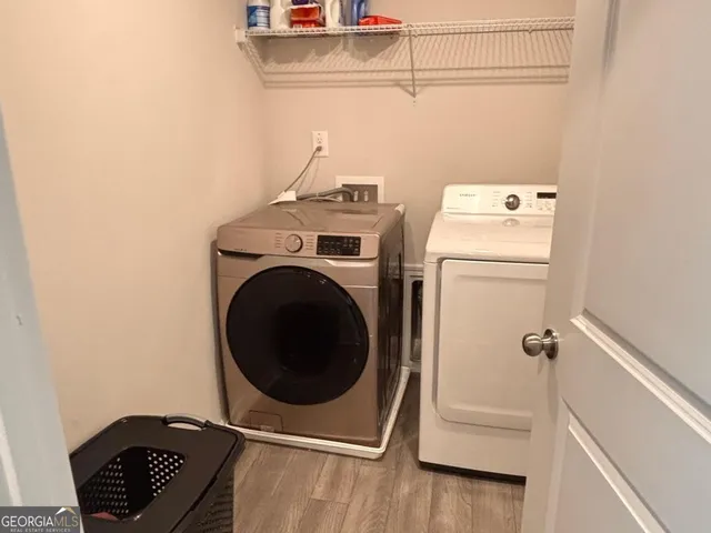 a utility room with dryer and washer
