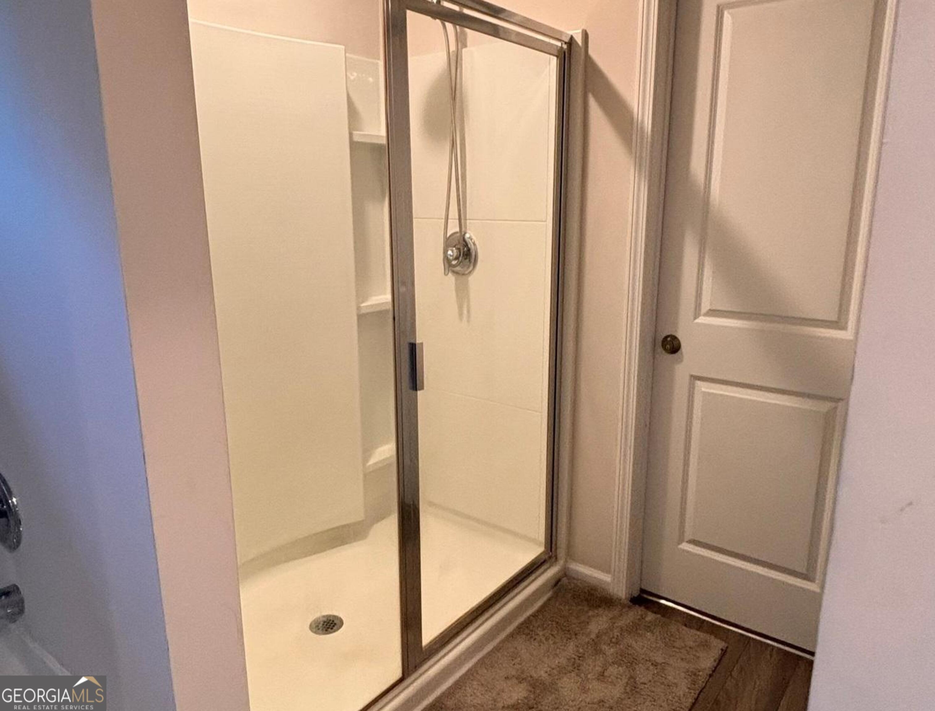 110 Summit Pointe Lane Dallas, GA 30132 - Photo 18 of 25 a bathroom with a glass shower door