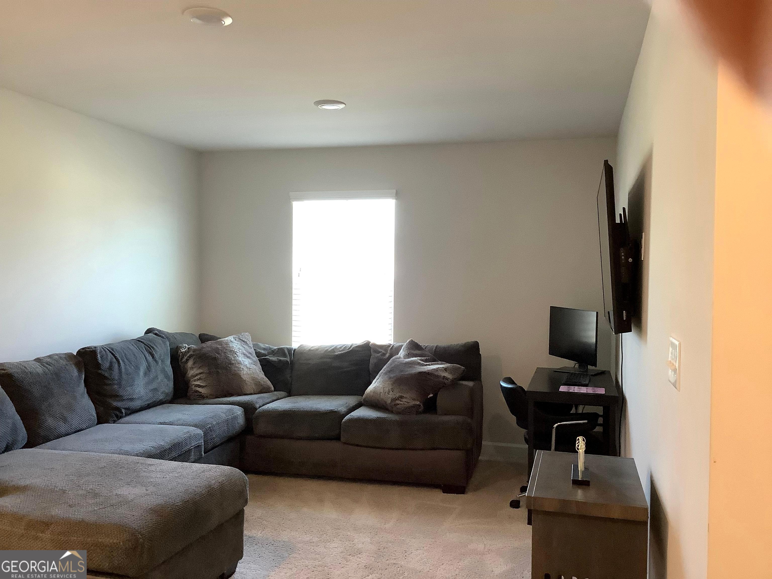 110 Summit Pointe Lane Dallas, GA 30132 - Photo 7 of 25 a living room with furniture and a flat screen tv