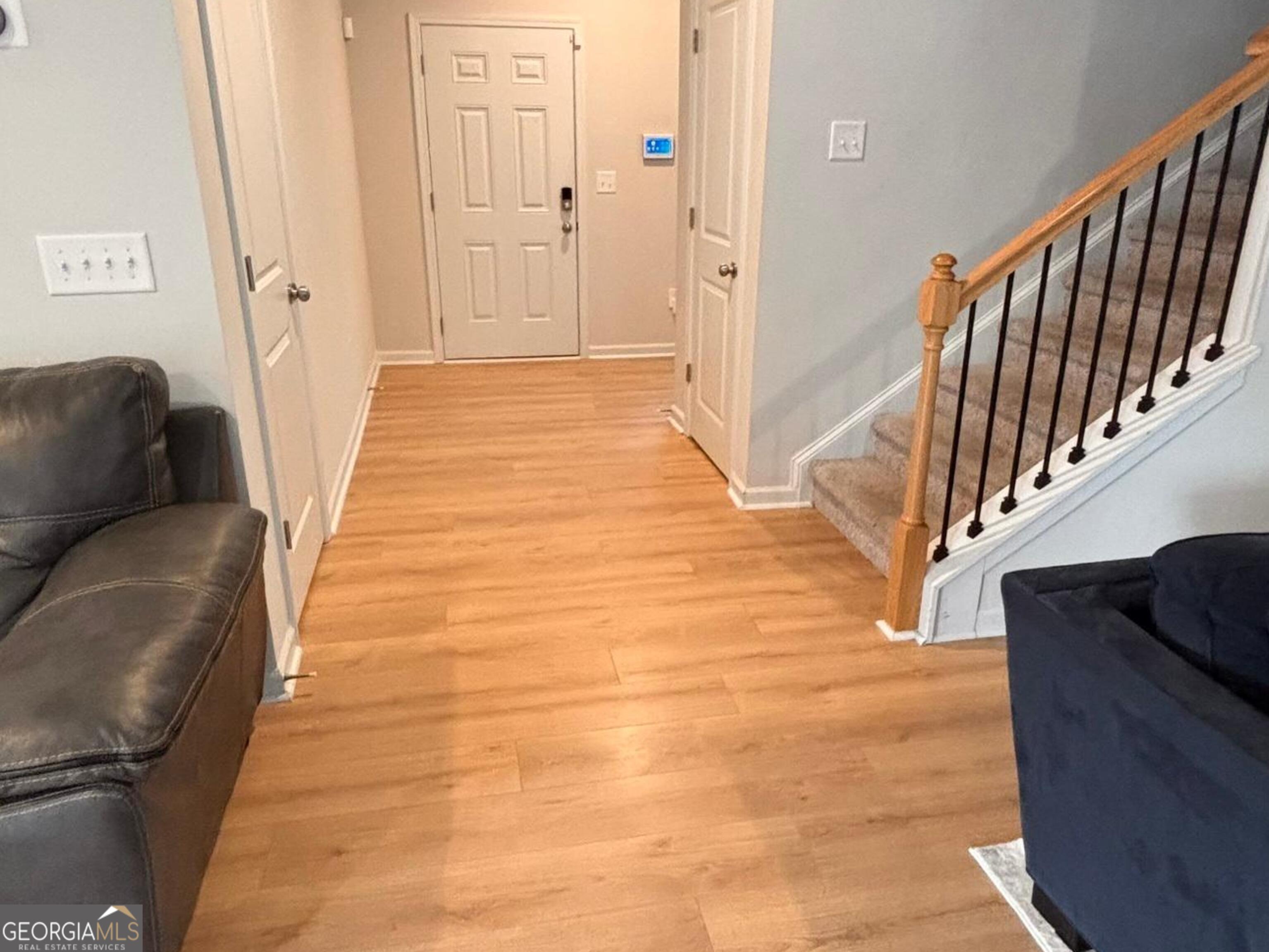 110 Summit Pointe Lane Dallas, GA 30132 - Photo 10 of 25 a view of a hallway with wooden floor and staircase