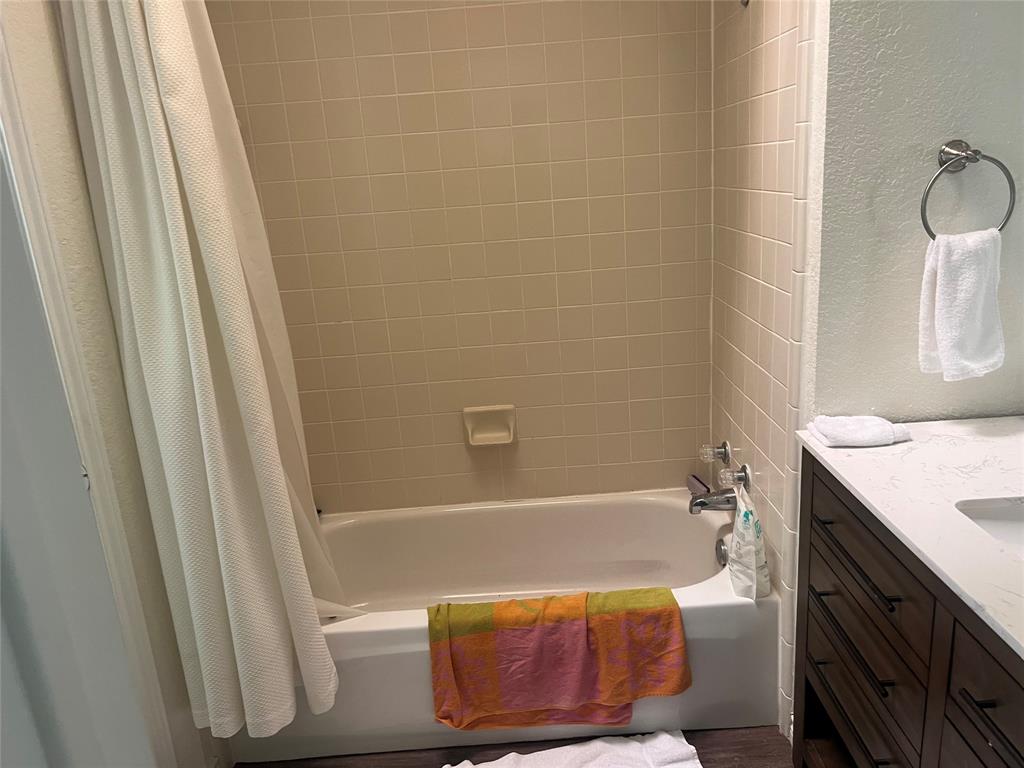 13104 Range Court Whitney, TX 76692 - Photo 3 of 6 a bathroom with a sink and a bathtub