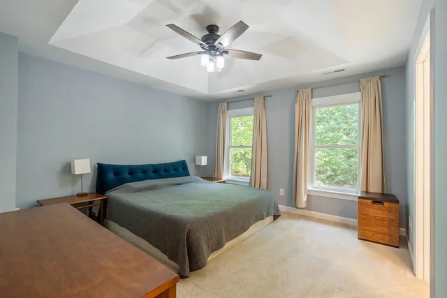 a bedroom with double bed and a large window