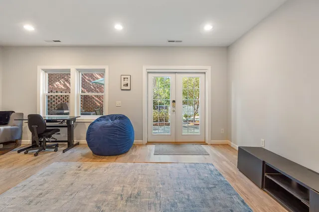 an empty room with furniture and windows