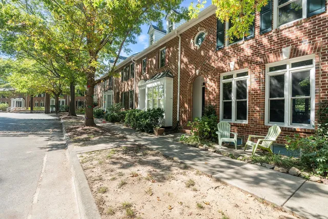 a view of a building with sitting area