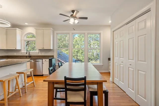 a view of a dining room with furniture window and wooden floor