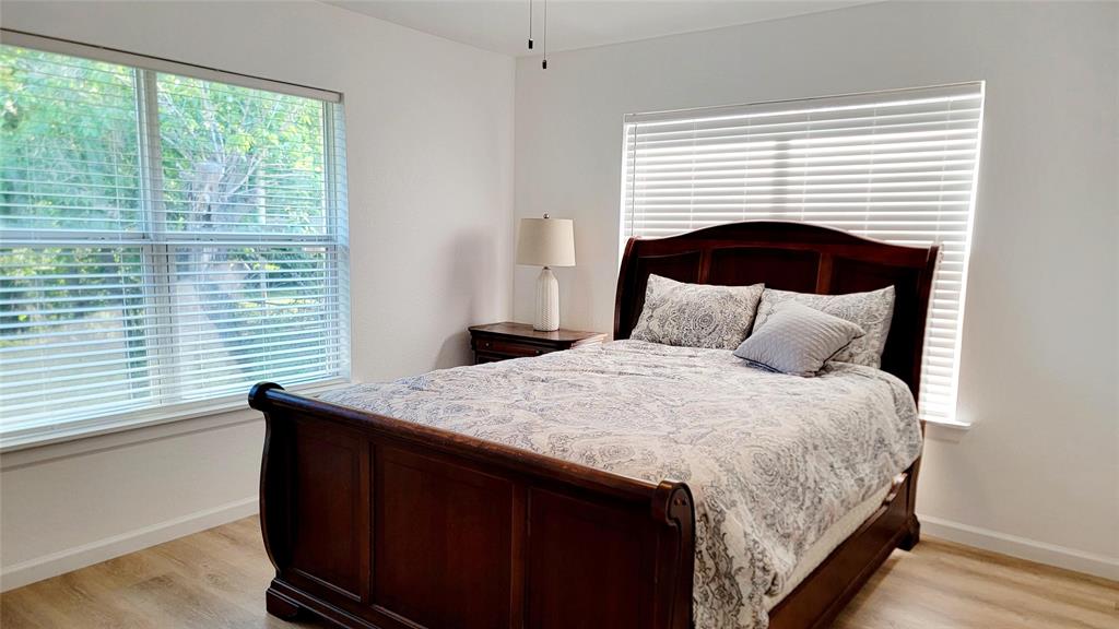 1447 West Lingleville Road Stephenville, TX 76401 - Photo 11 of 12 Bedroom with light wood finished floors