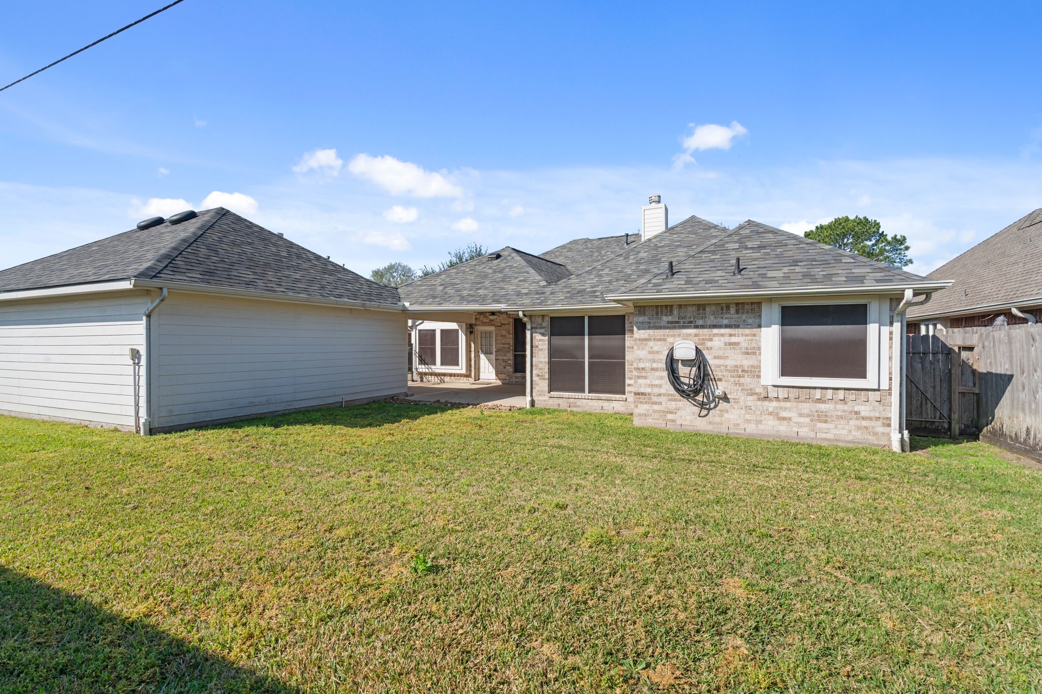 9122 Sunny Ridge Drive Houston, TX 77095 - Photo 15 of 15 a backyard of a house with table and chairs