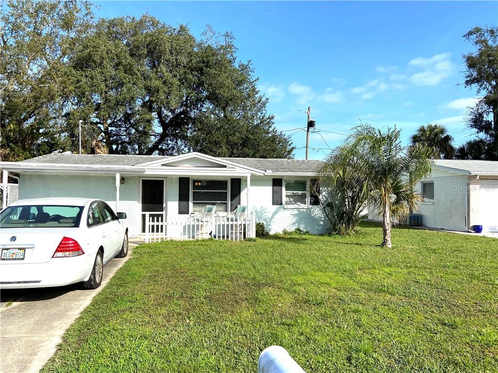 4617 Irene Loop New Port Richey, FL 34652 - Photo 1 of 1 a view of a house with backyard and porch