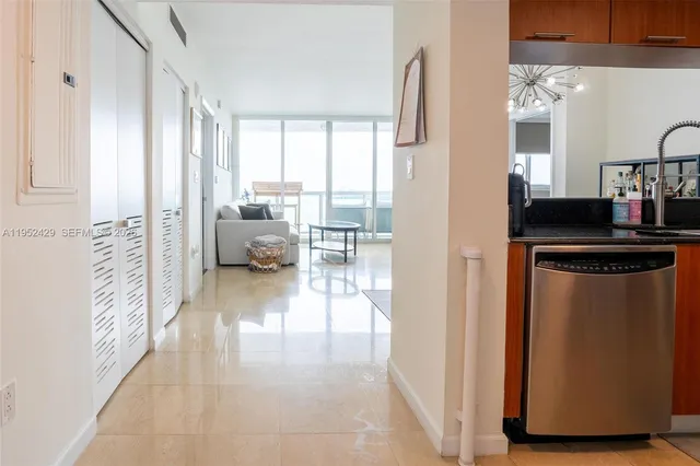 a view of living room with furniture and floor to ceiling window