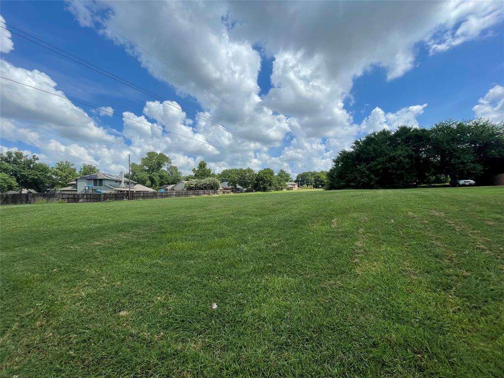 2309 Meadows Lane Sherman, TX 75092 - Photo 3 of 11 a backyard of a house with lots of green space