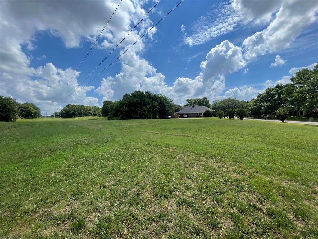 2309 Meadows Lane Sherman, TX 75092 - Photo 9 of 11 a view of a building in the middle of a field