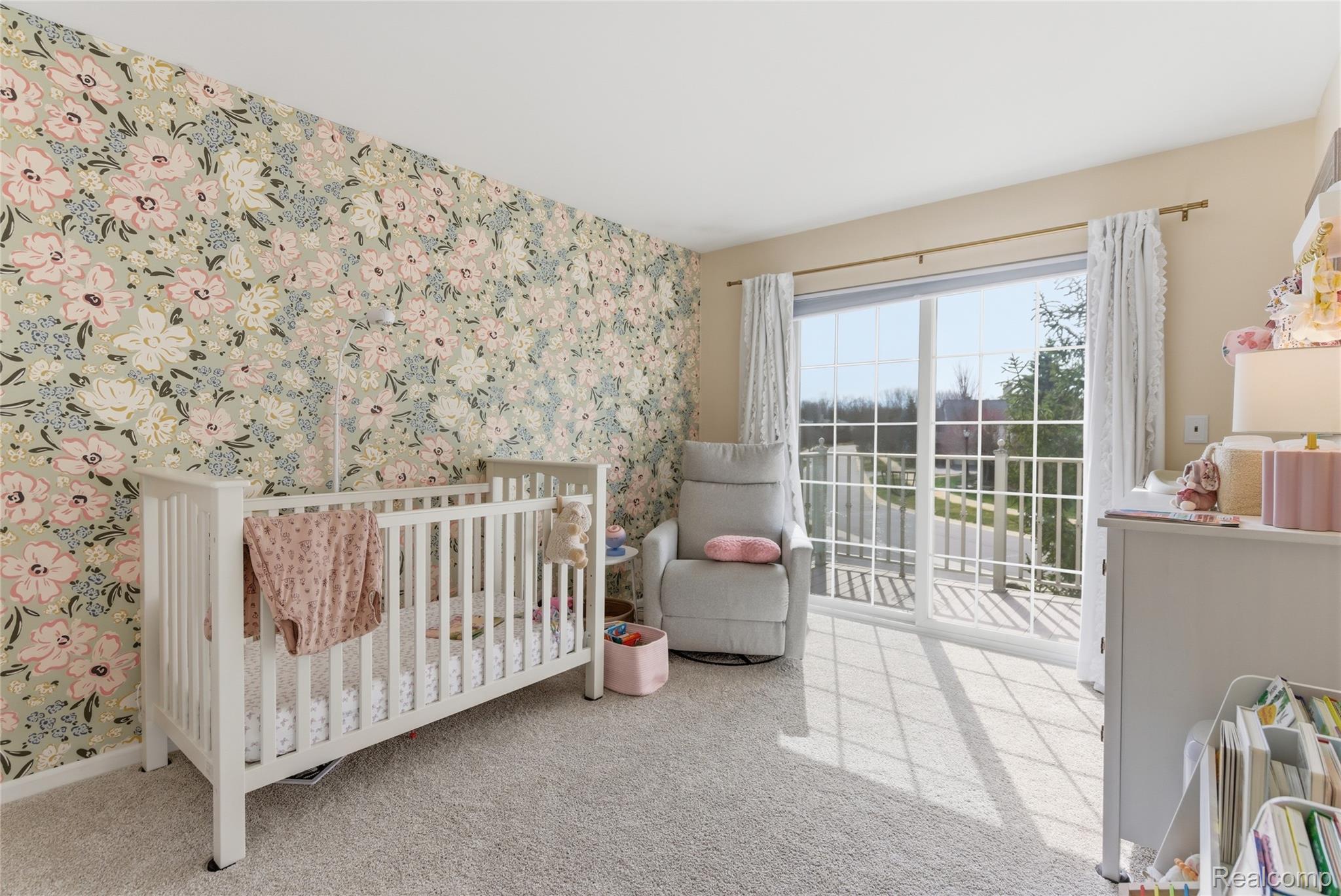 3402 Tremonte Circle Rochester, MI 48306 - Photo 21 of 37 Bedroom with wallpapered walls, a crib, and light carpet