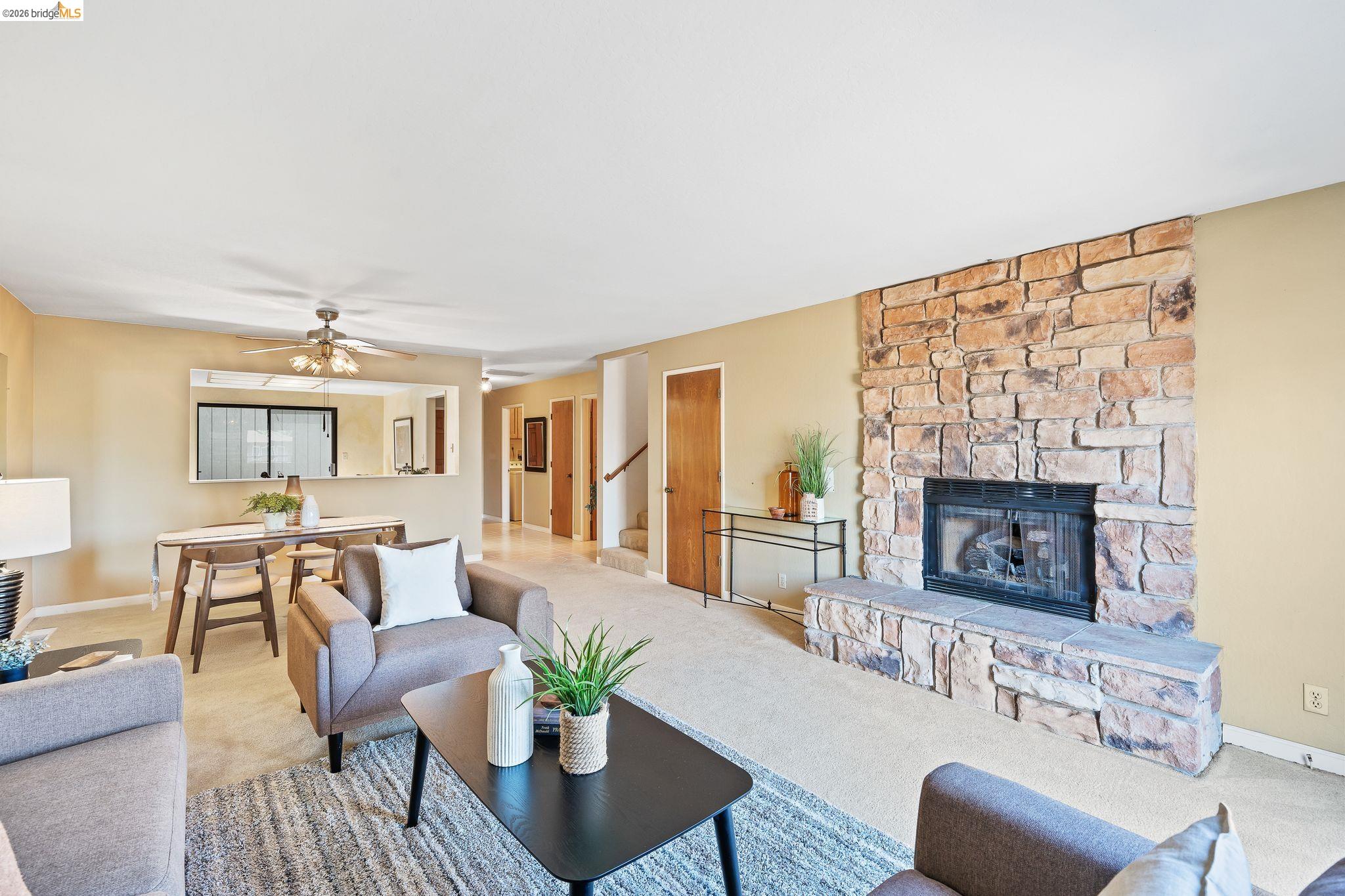 2051 Sand Point Road Discovery Bay, CA 94505 - Photo 13 of 47 Spacious living area featuring a stone-clad fireplace and hearth