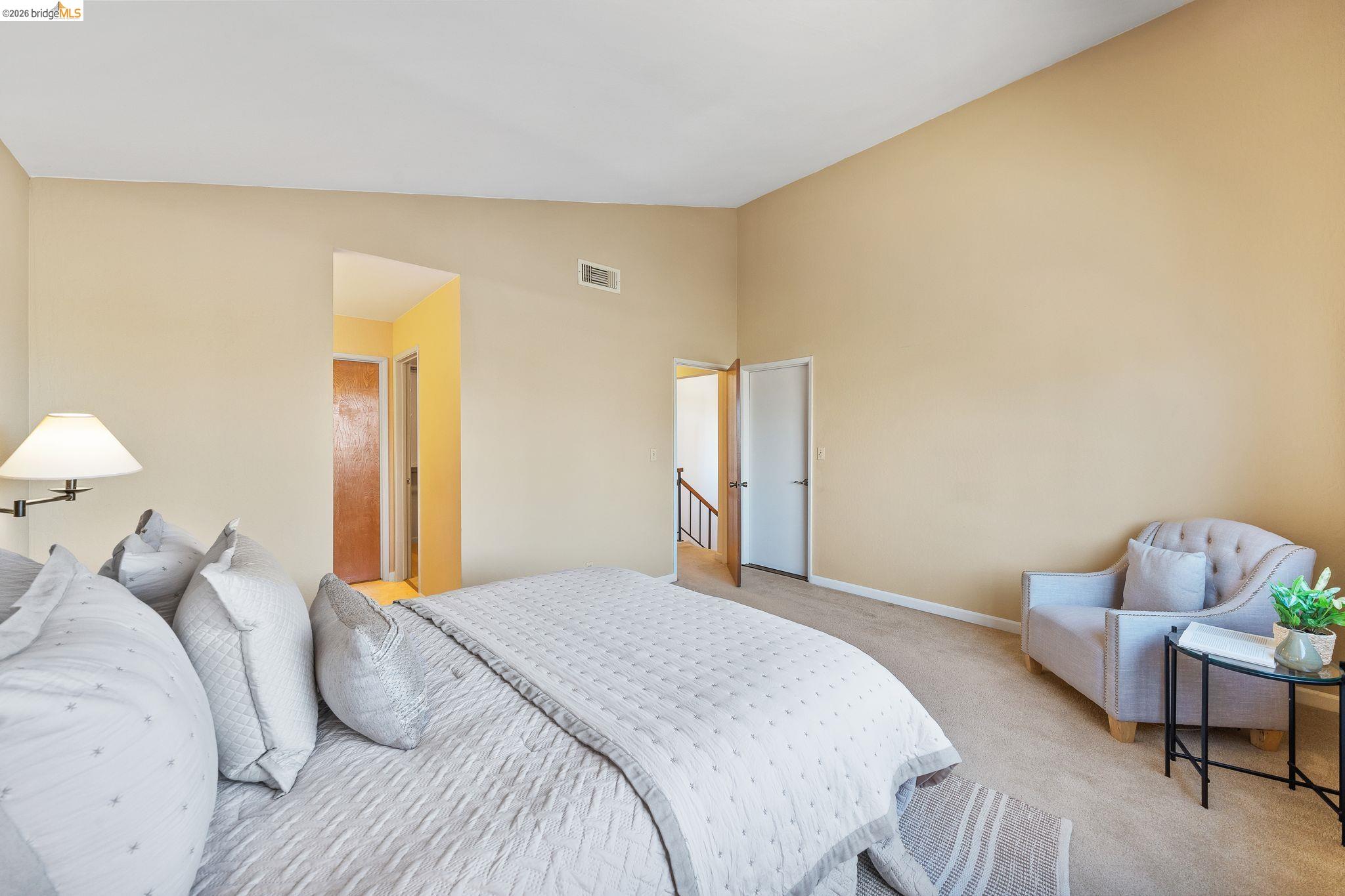 2051 Sand Point Road Discovery Bay, CA 94505 - Photo 28 of 47 Carpeted bedroom featuring vaulted ceilings and a neutral color palette