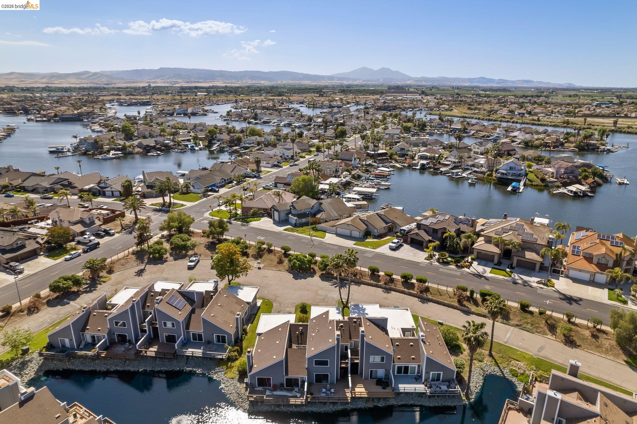 2051 Sand Point Road Discovery Bay, CA 94505 - Photo 39 of 47 Aerial perspective of a waterfront community featuring canal-front residences and established streetscapes