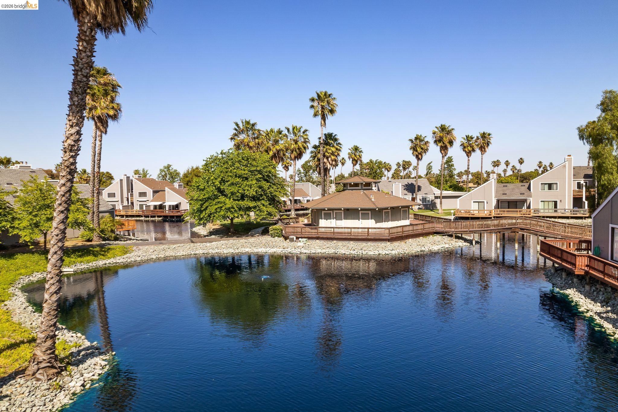 2051 Sand Point Road Discovery Bay, CA 94505 - Photo 44 of 47 Waterfront community featuring a central gazebo structure, extensive wooden decking, and surrounding residences with private balconies