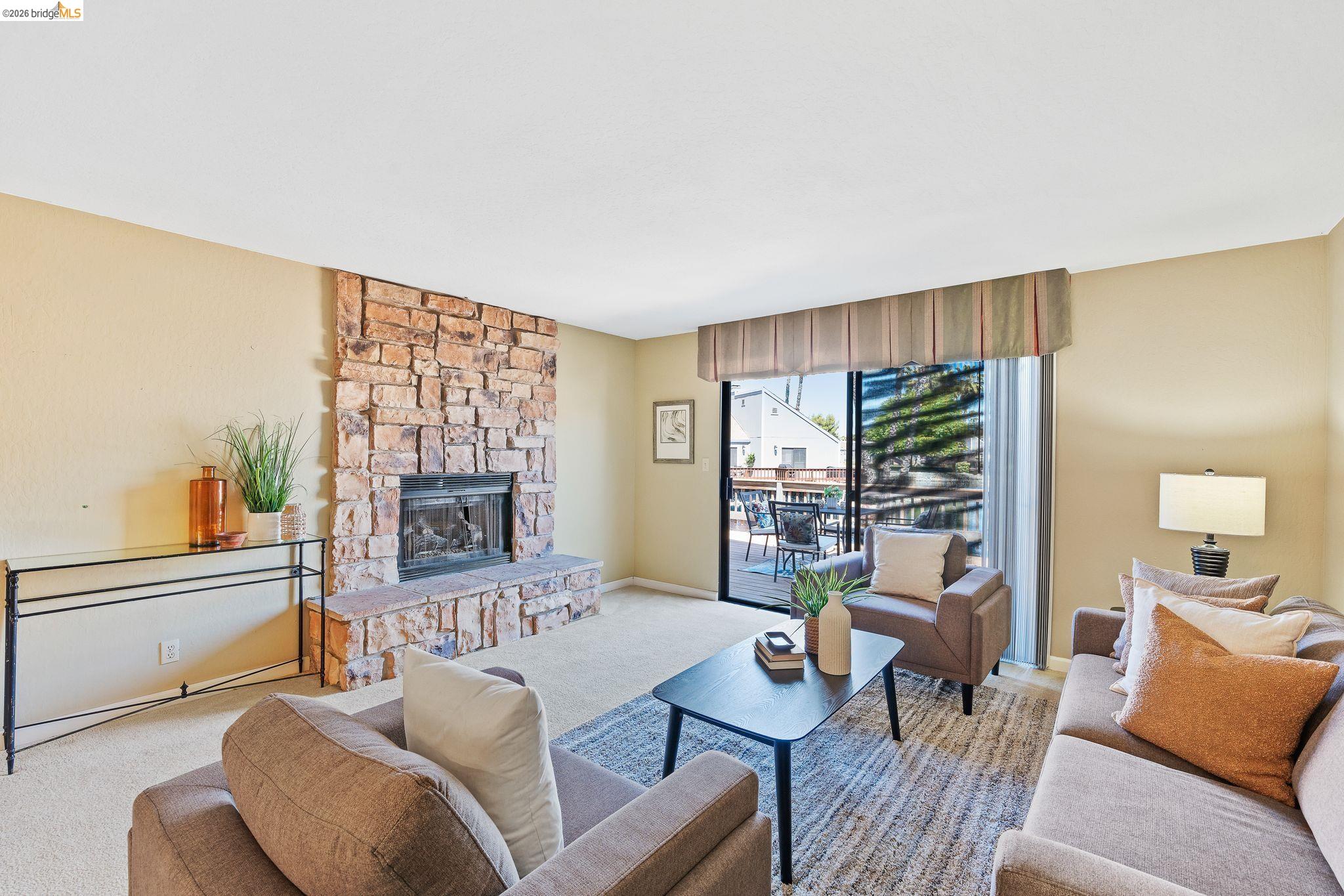 2051 Sand Point Road Discovery Bay, CA 94505 - Photo 9 of 47 Stone-faced fireplace with a hearth extending into the room